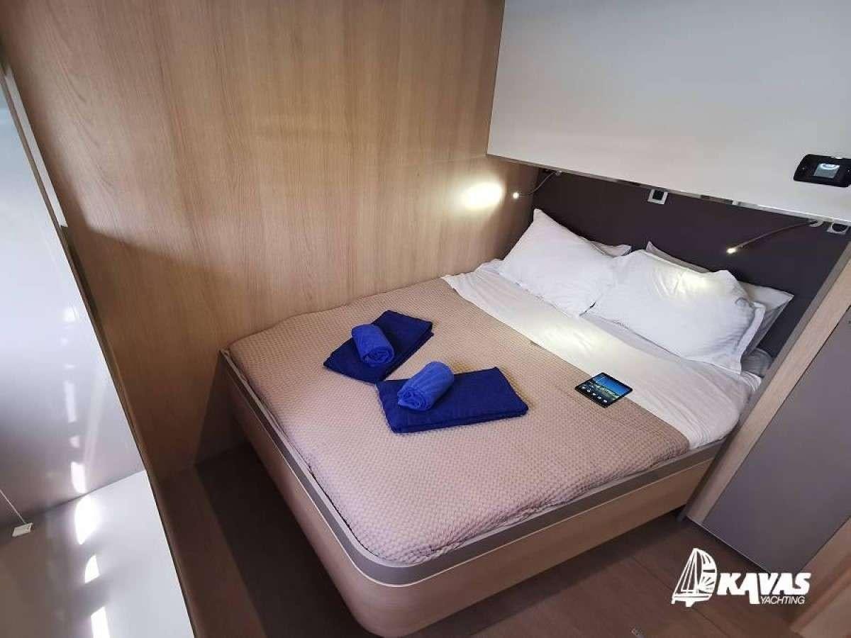 a bed in a room aboard Kos 54.Cat (Athens) Yacht for Charter