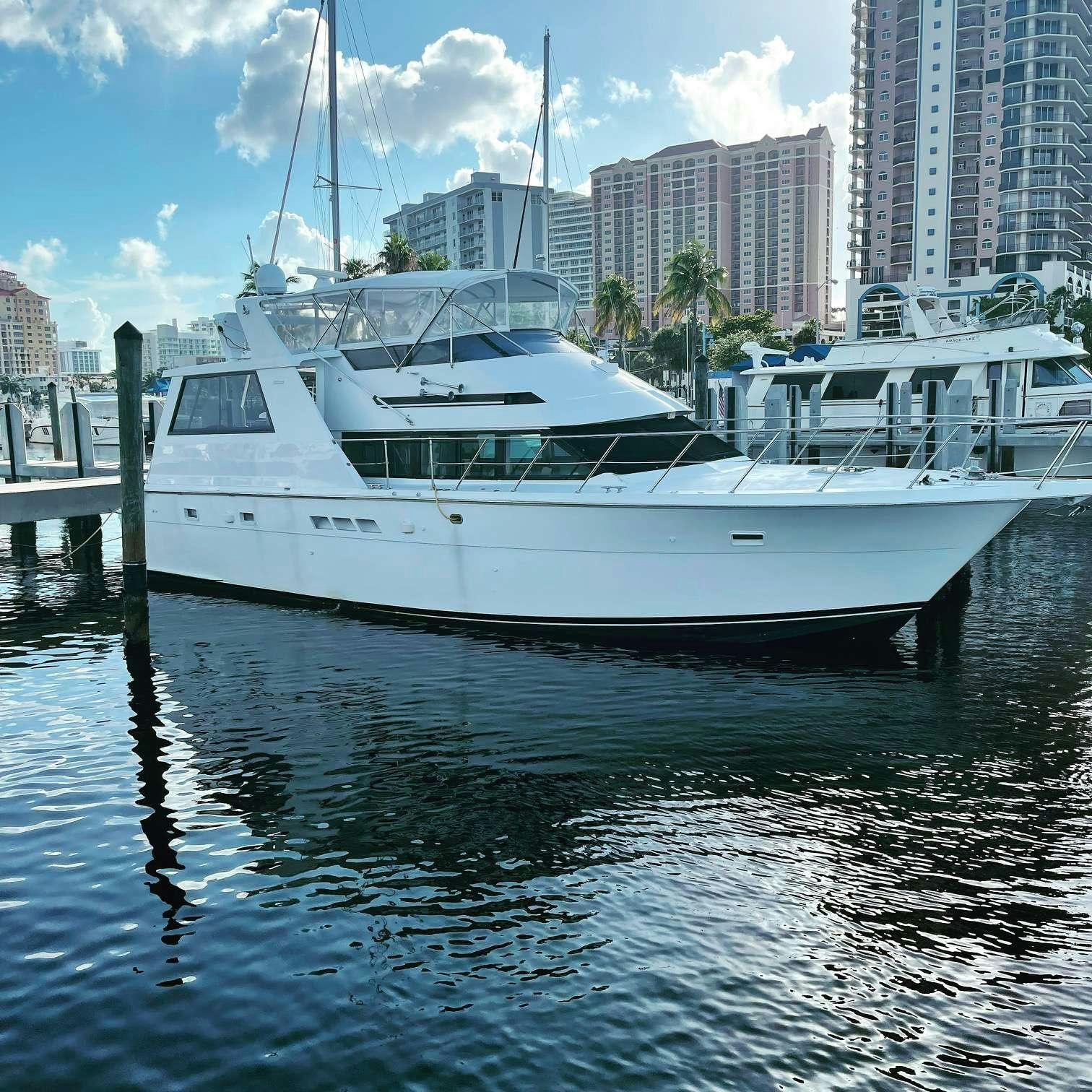 a white boat on the water aboard DIVINE Yacht for Charter