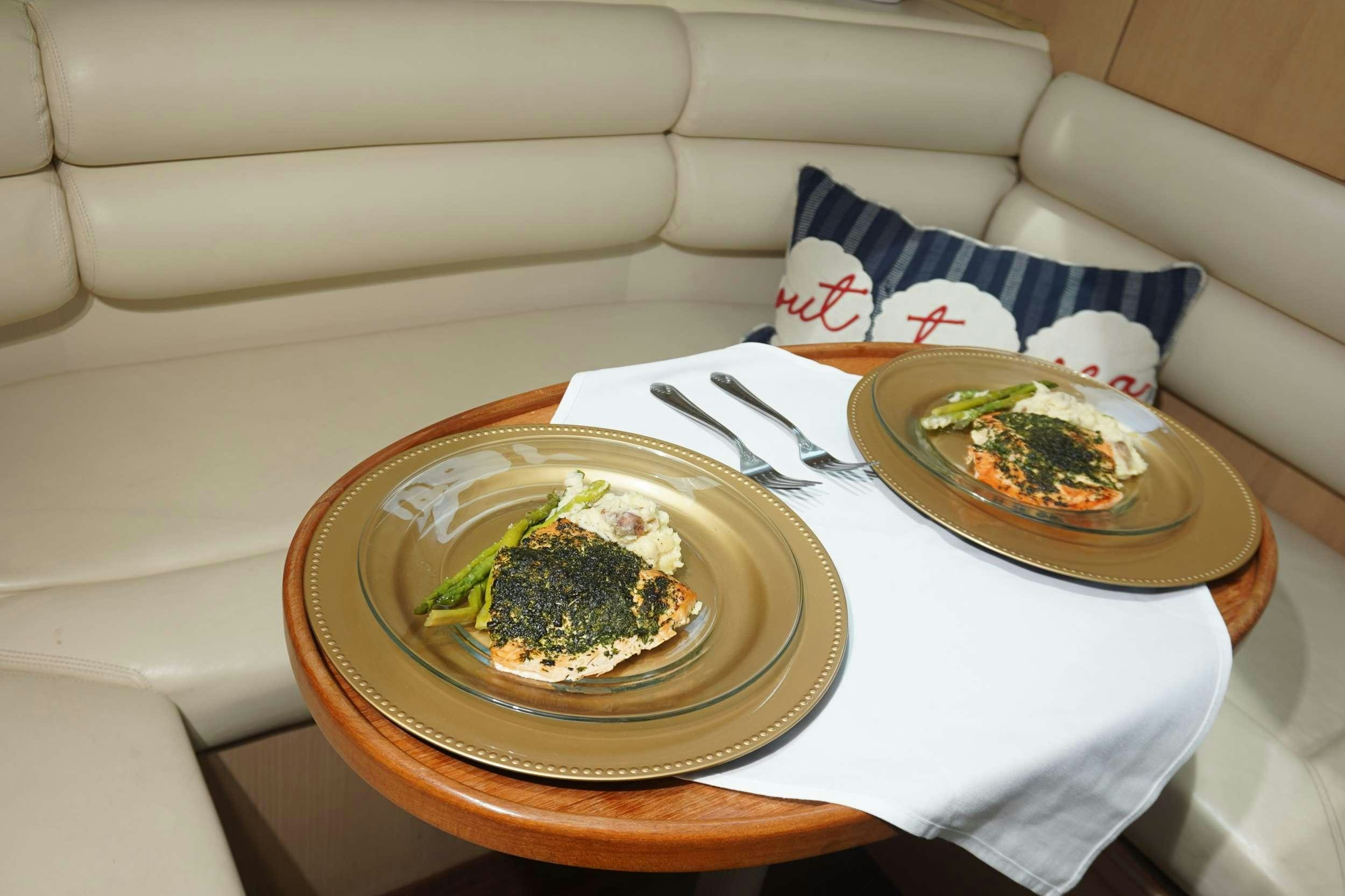 a plate of food on a table aboard DIVINE Yacht for Charter