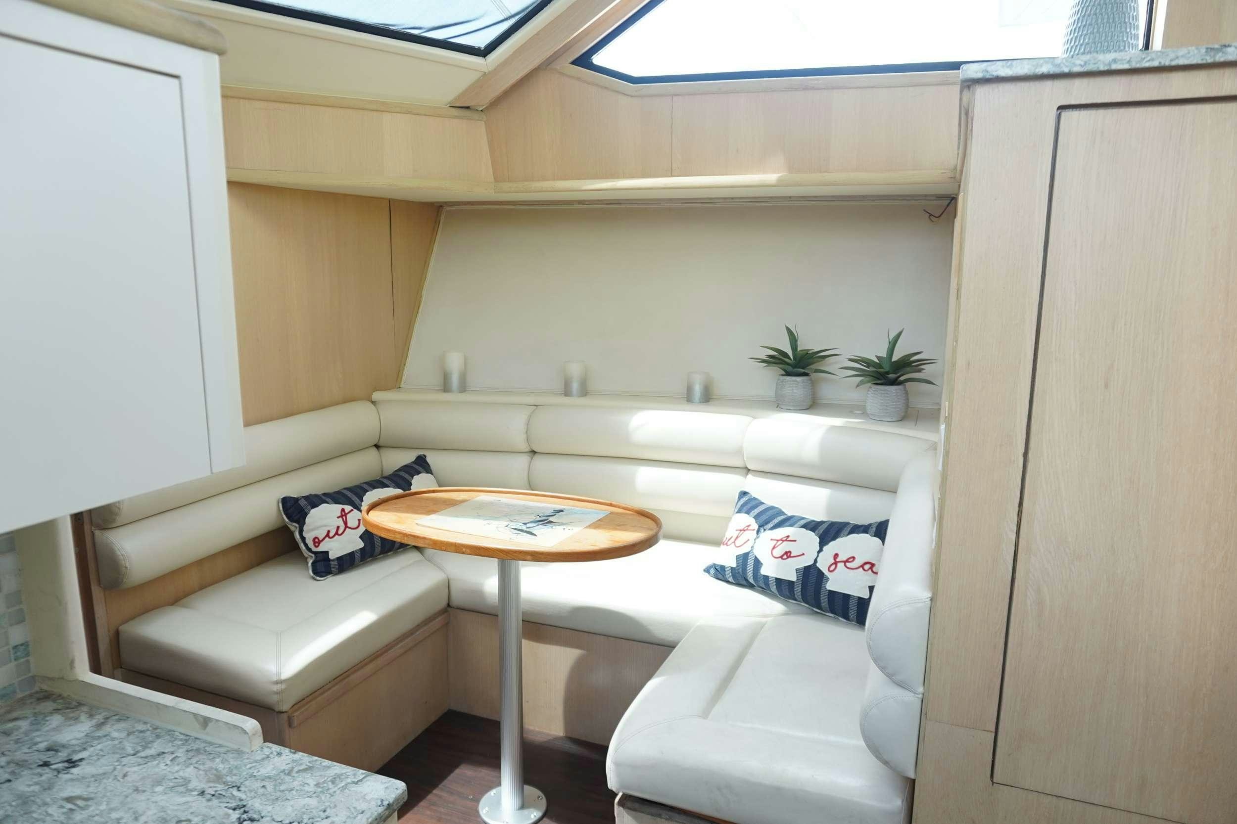 a room with a couch and a table aboard DIVINE Yacht for Charter