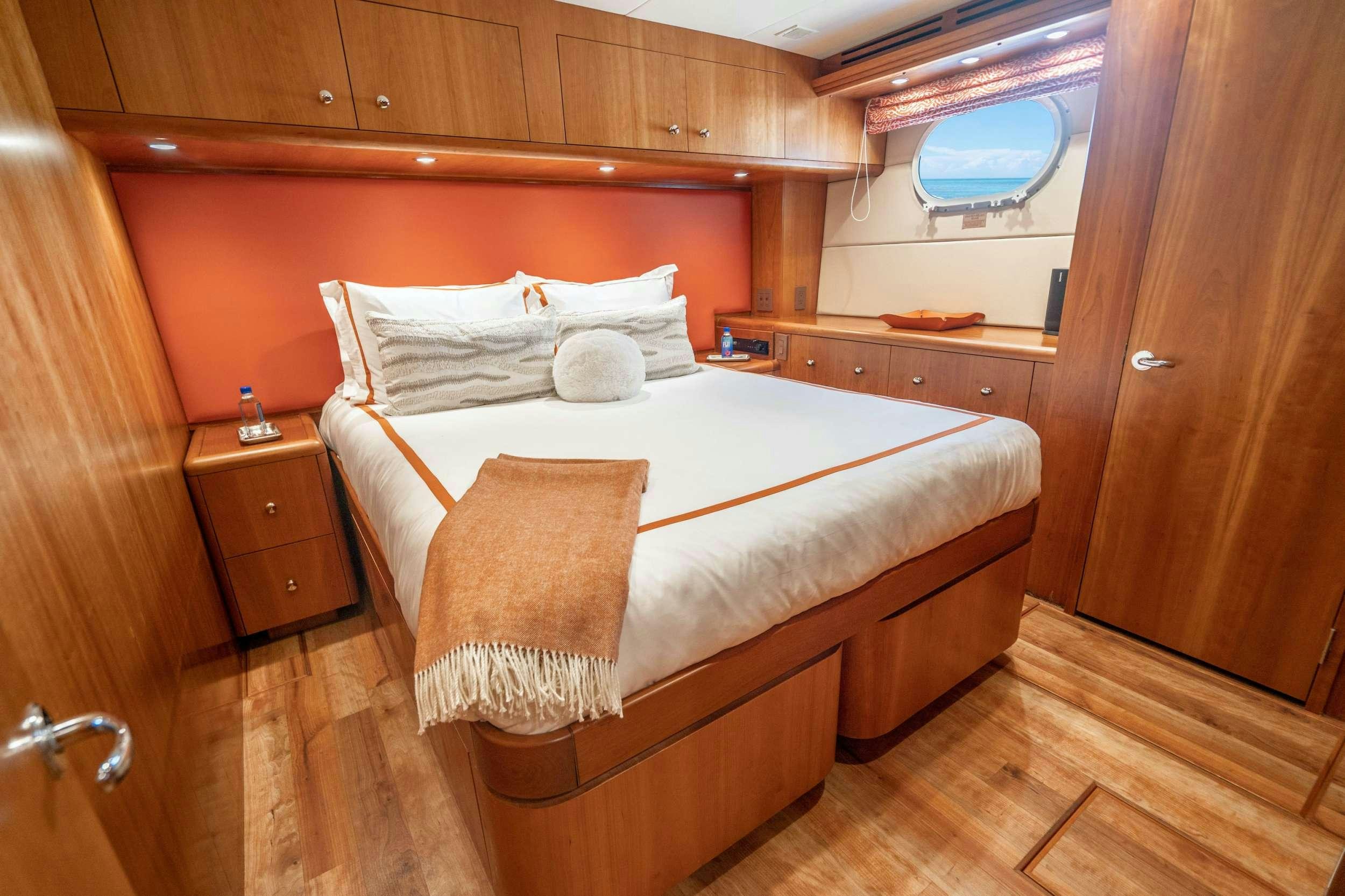 a bed in a room aboard CENTODUE Yacht for Charter