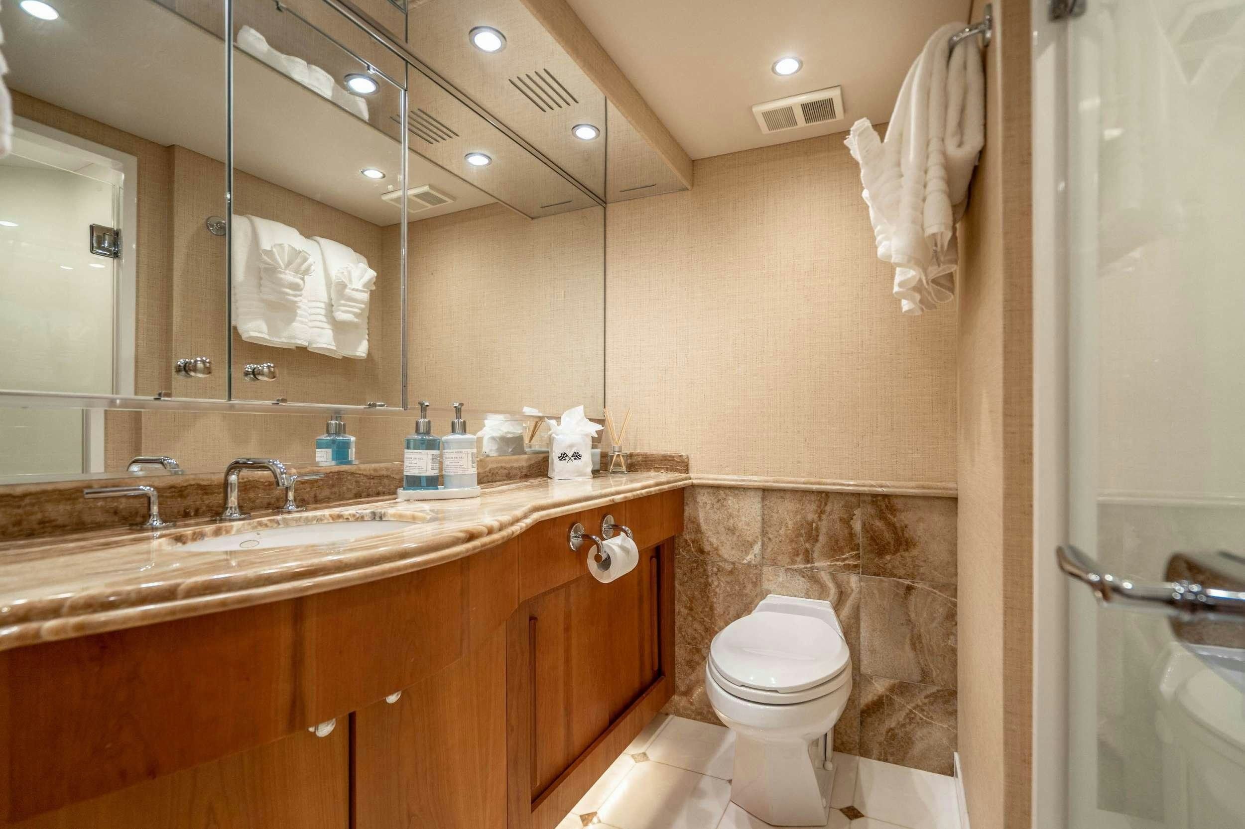 a bathroom with a large mirror aboard CENTODUE Yacht for Charter