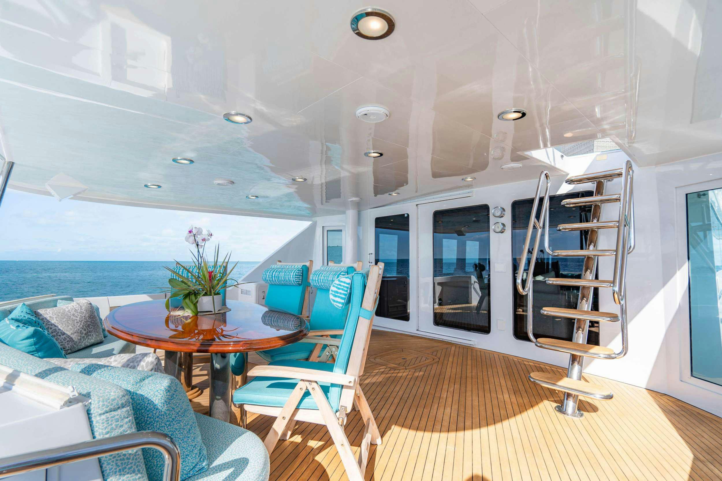 a living room with a ladder aboard CENTODUE Yacht for Charter