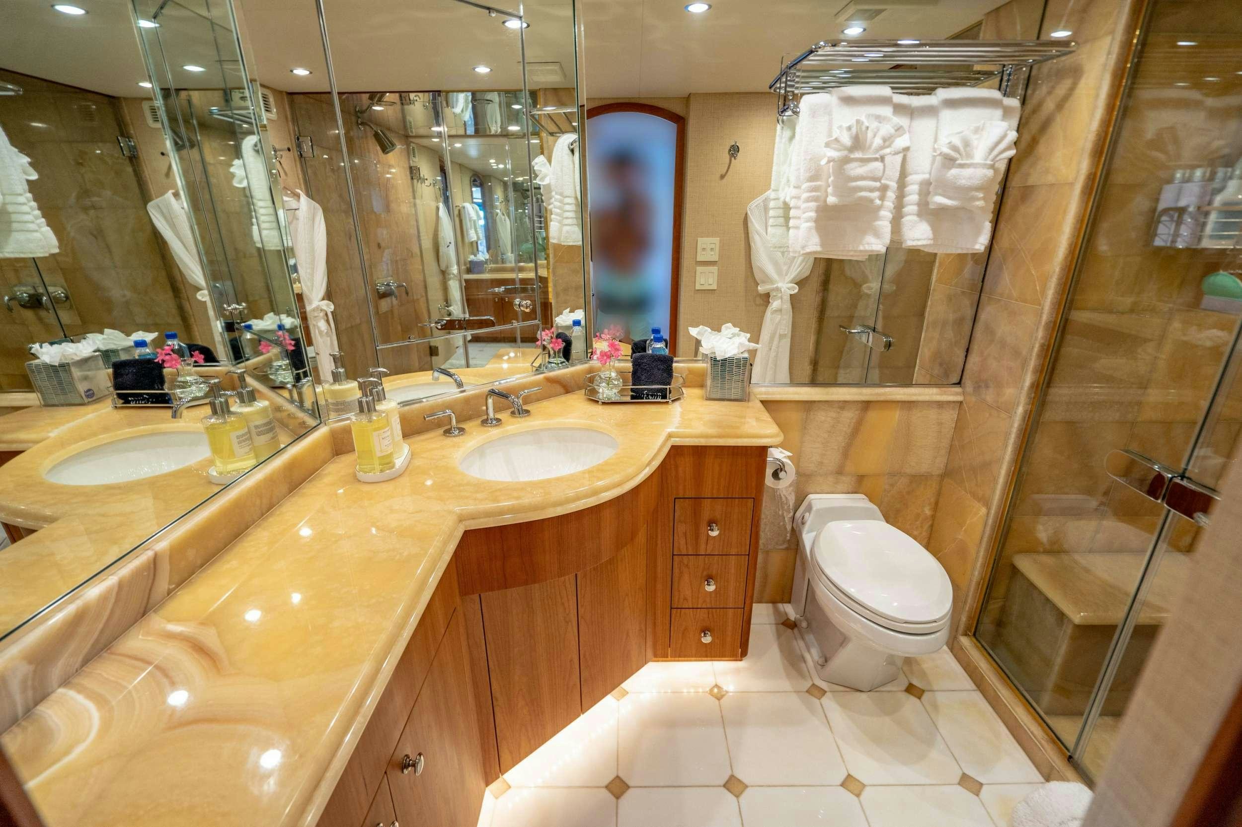 a bathroom with a large mirror aboard CENTODUE Yacht for Charter