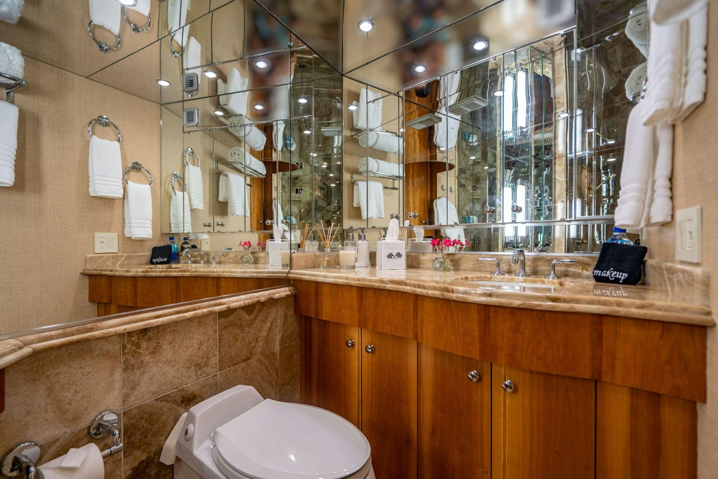 a bathroom with a large mirror aboard CENTODUE Yacht for Charter