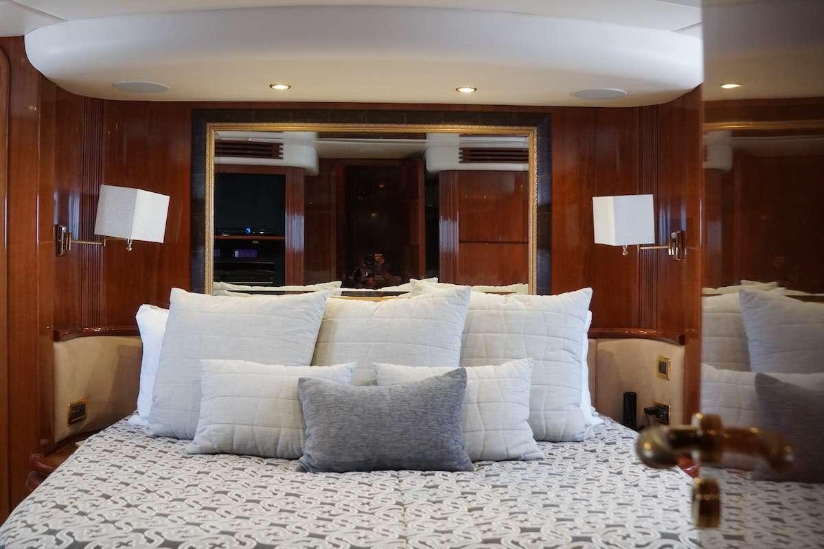 a bed with pillows aboard AZURE Yacht for Charter