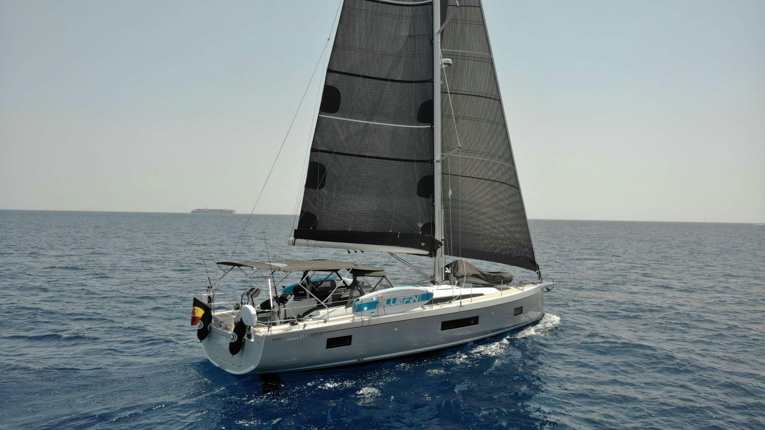 a sailboat on the water aboard MIO SHI Yacht for Charter