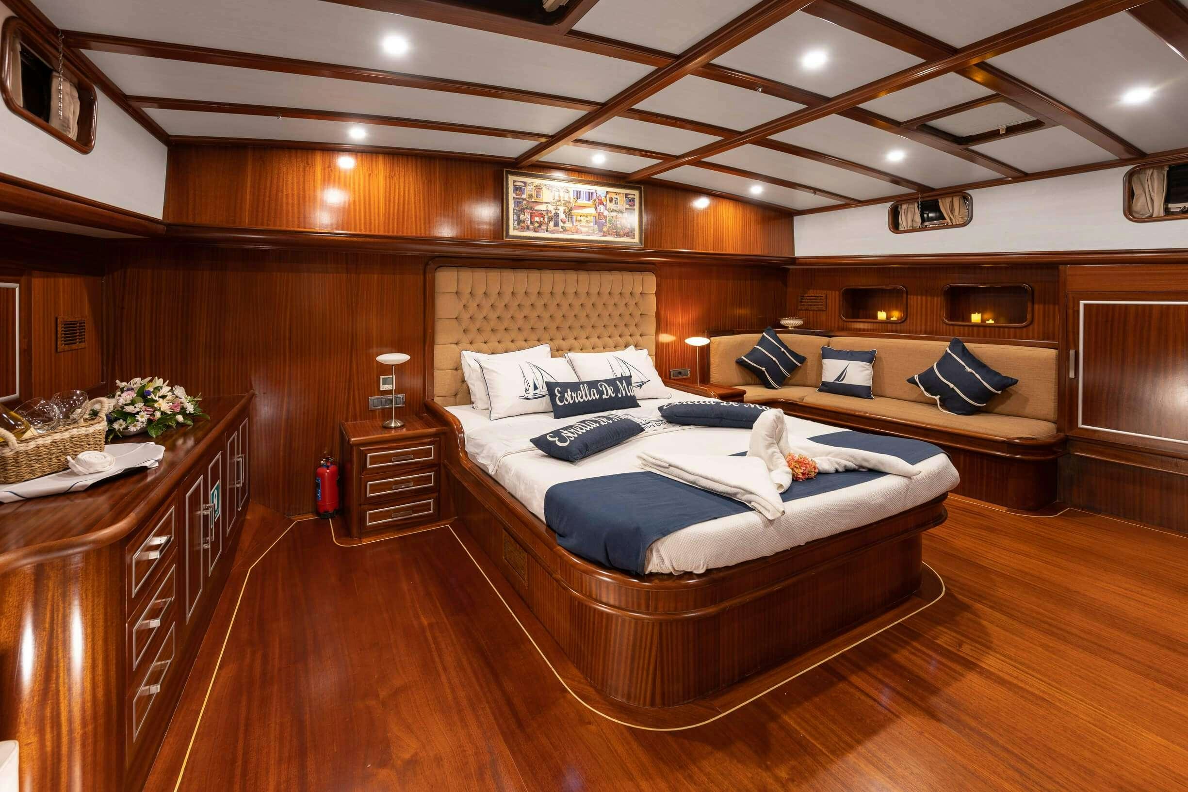 a large bedroom with a large bed aboard ESTRELLA DE MAR Yacht for Charter