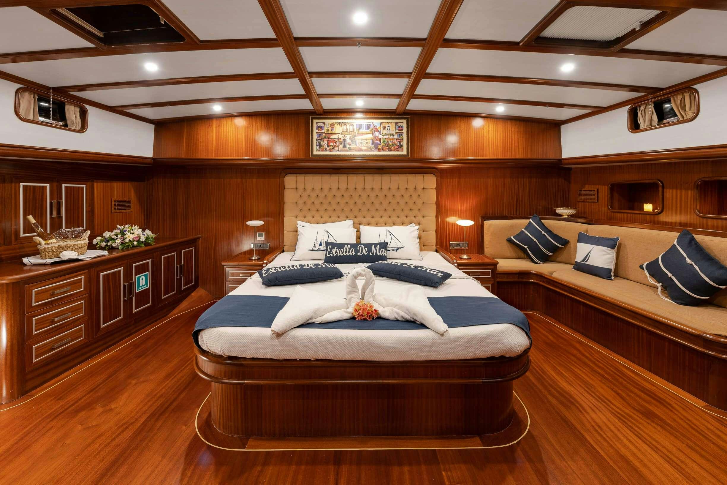 a large bedroom with a large bed aboard ESTRELLA DE MAR Yacht for Charter