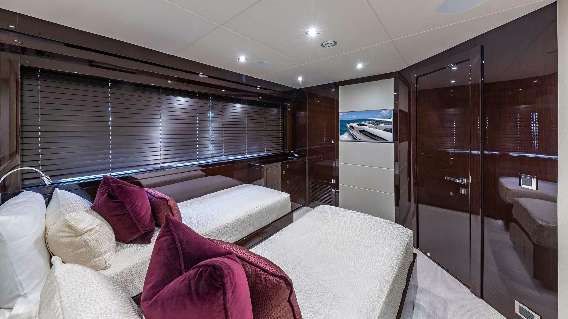 a room with a bed and a mirror aboard MIRRACLE Yacht for Charter