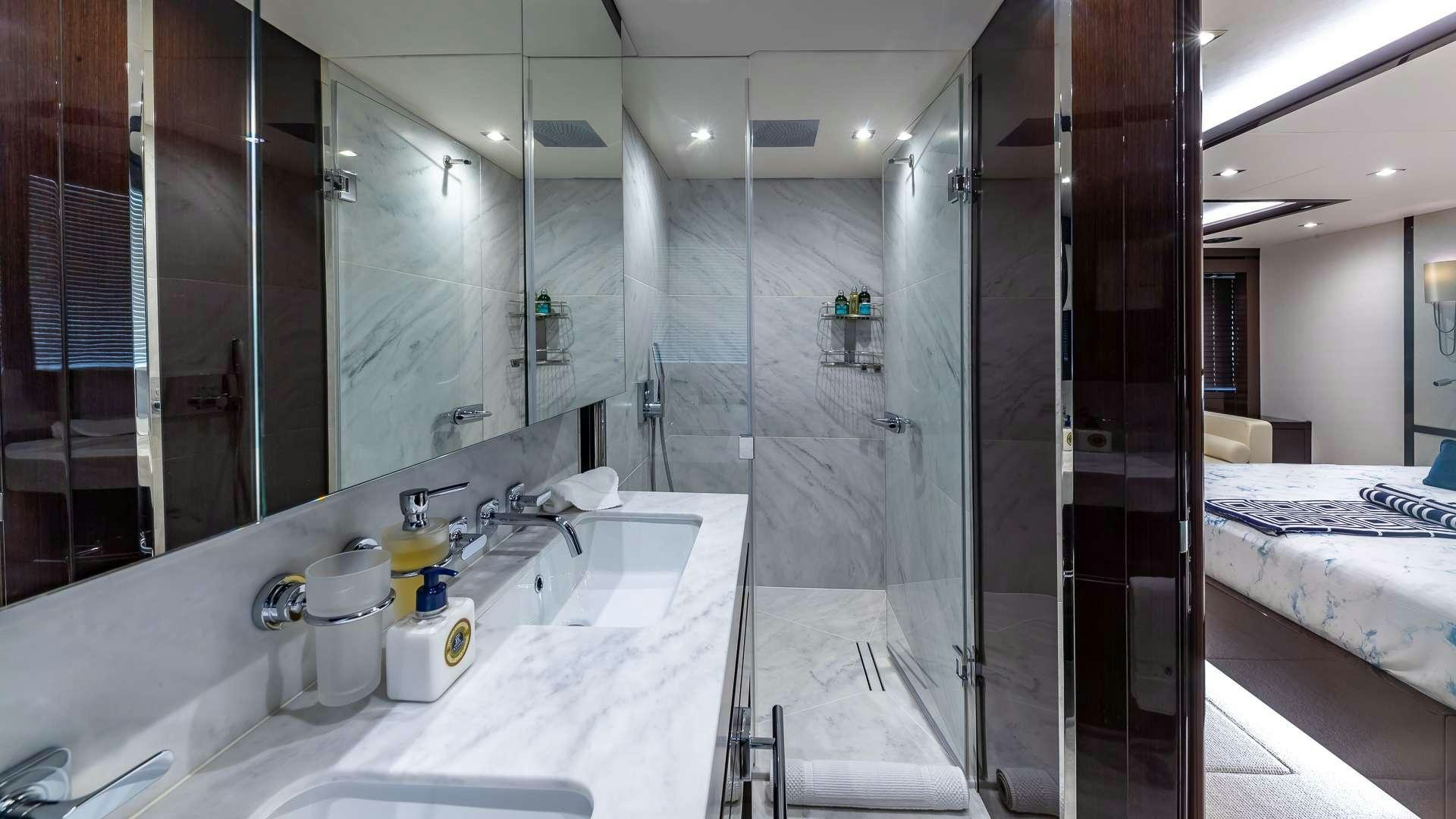 a bathroom with a large glass shower aboard MIRRACLE Yacht for Charter