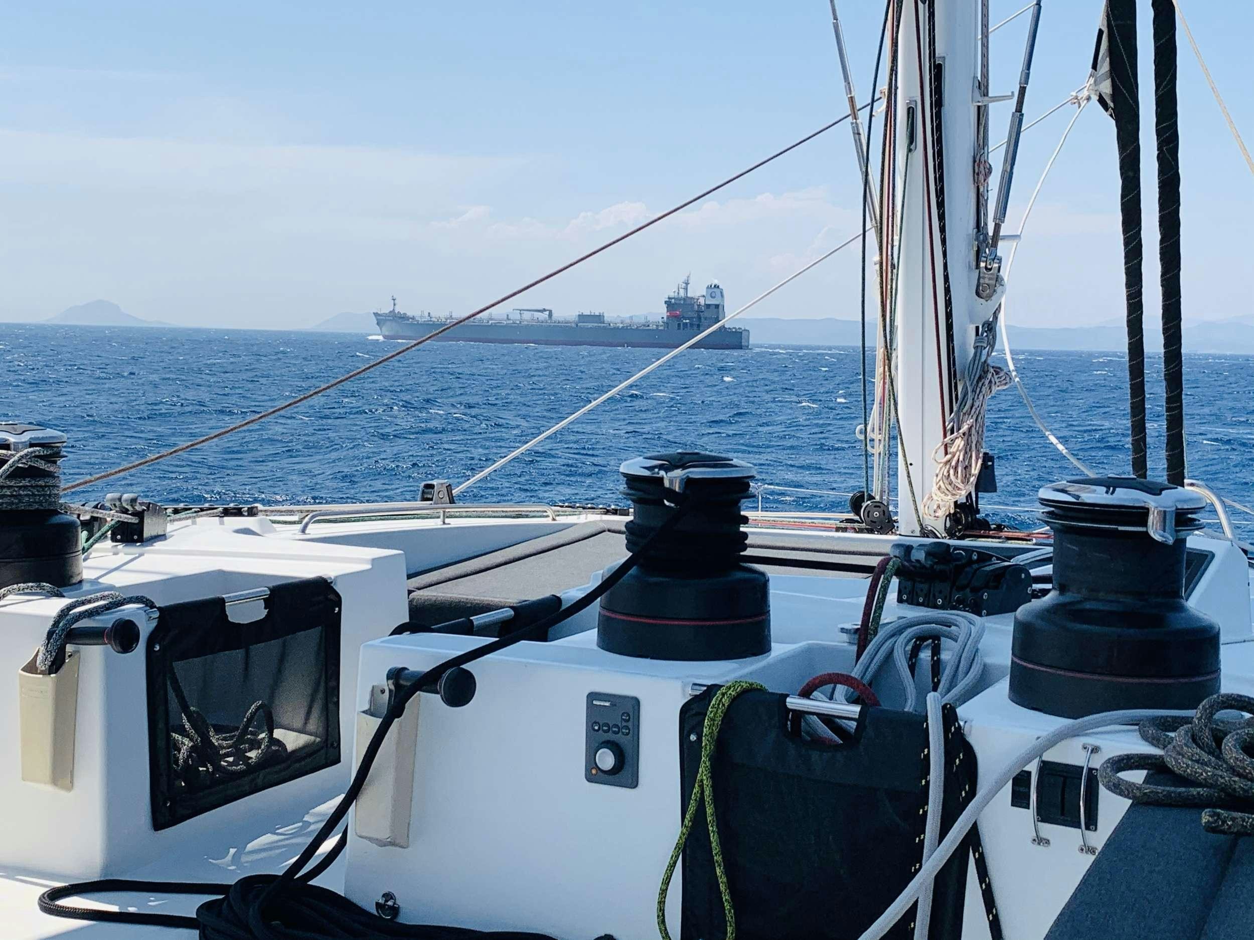 a boat with a large sail aboard JARANA Yacht for Charter