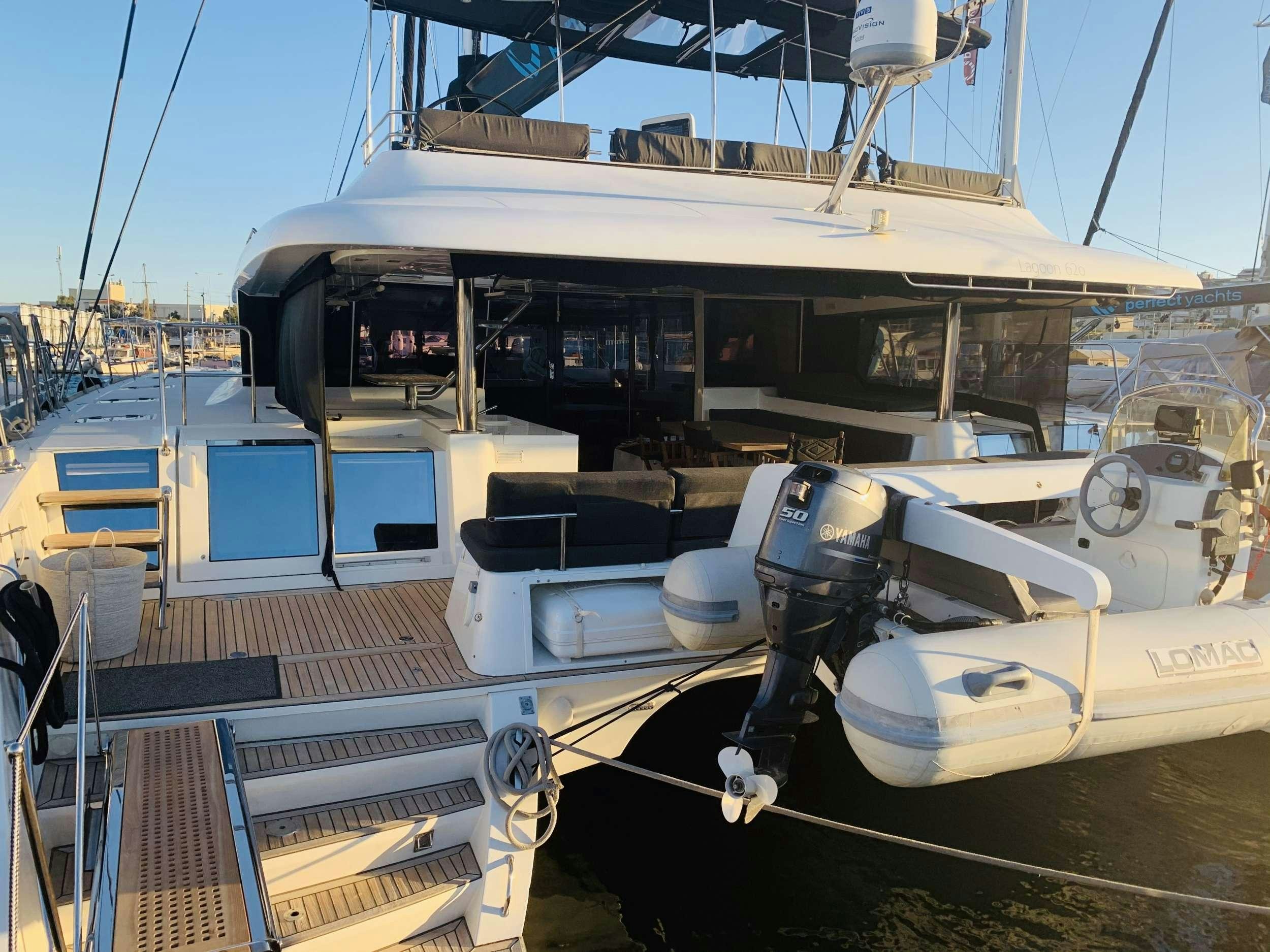 a boat docked at a pier aboard JARANA Yacht for Charter