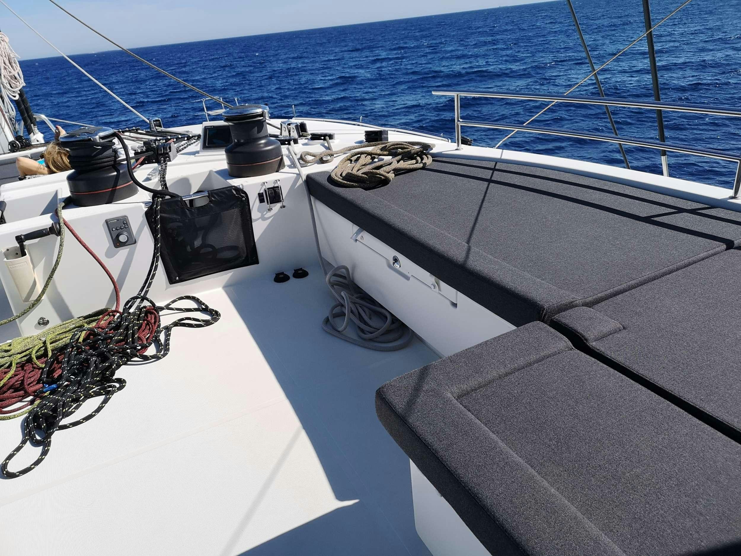 a boat with a rope attached to it aboard JARANA Yacht for Charter