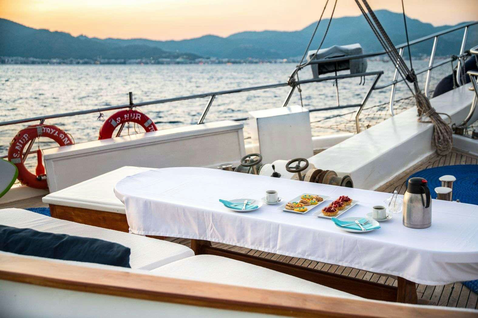 a table on a boat aboard S NUR TAYLAN Yacht for Charter