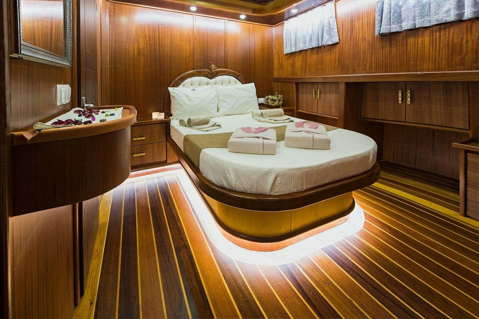 a bed in a room aboard S NUR TAYLAN Yacht for Charter