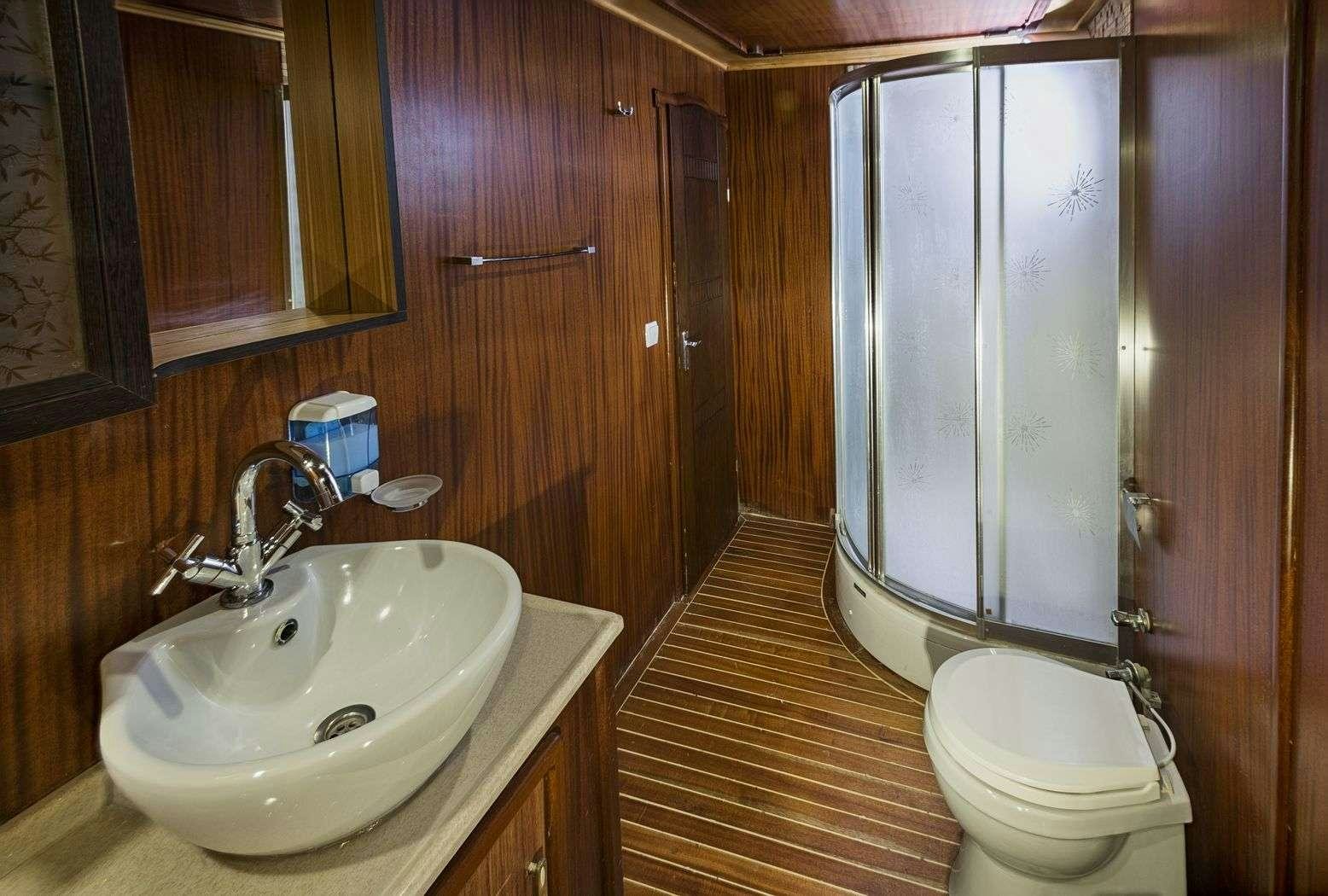 a bathroom with a toilet and sink aboard S NUR TAYLAN Yacht for Charter