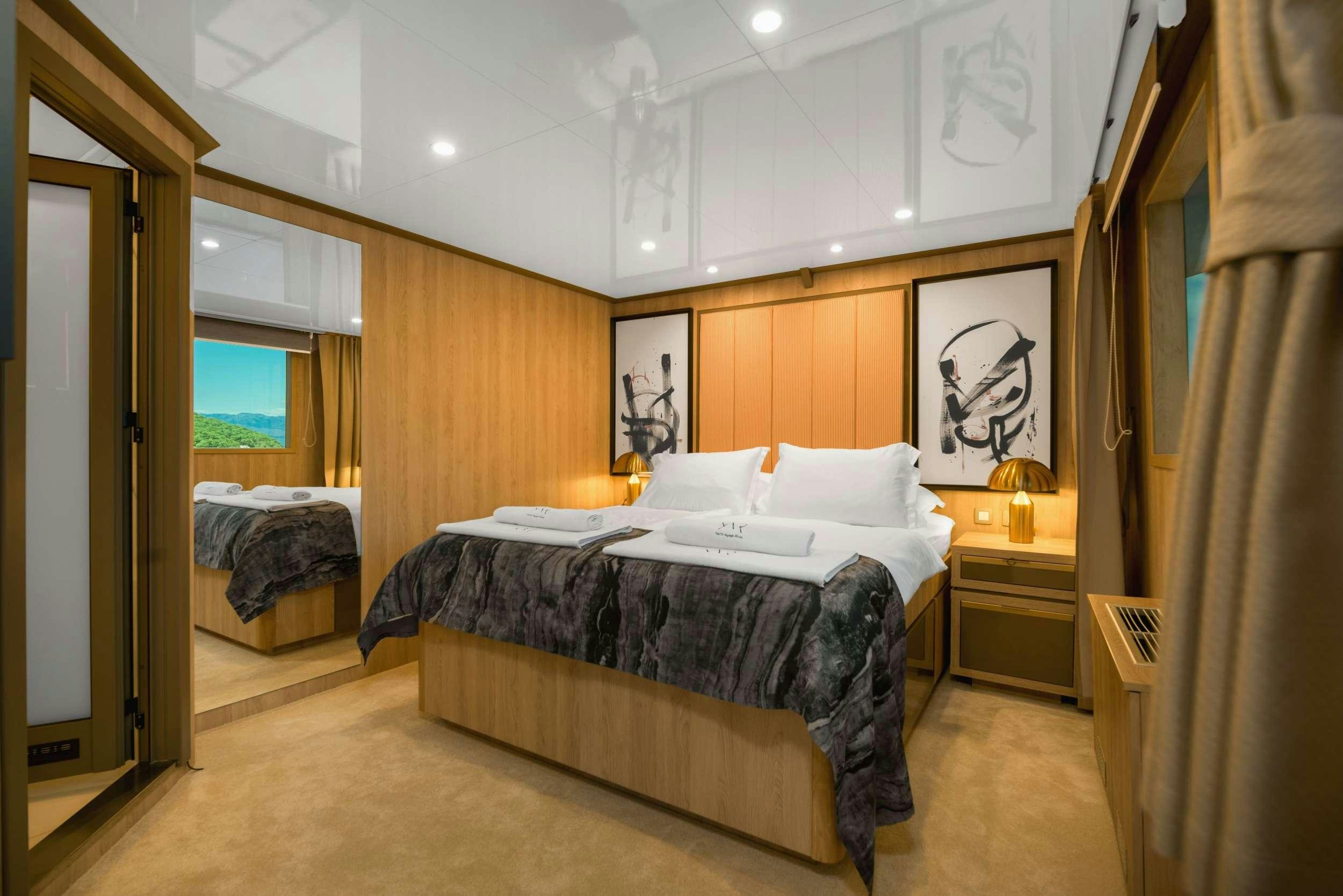 a room with two beds aboard AGAPE ROSE Yacht for Charter