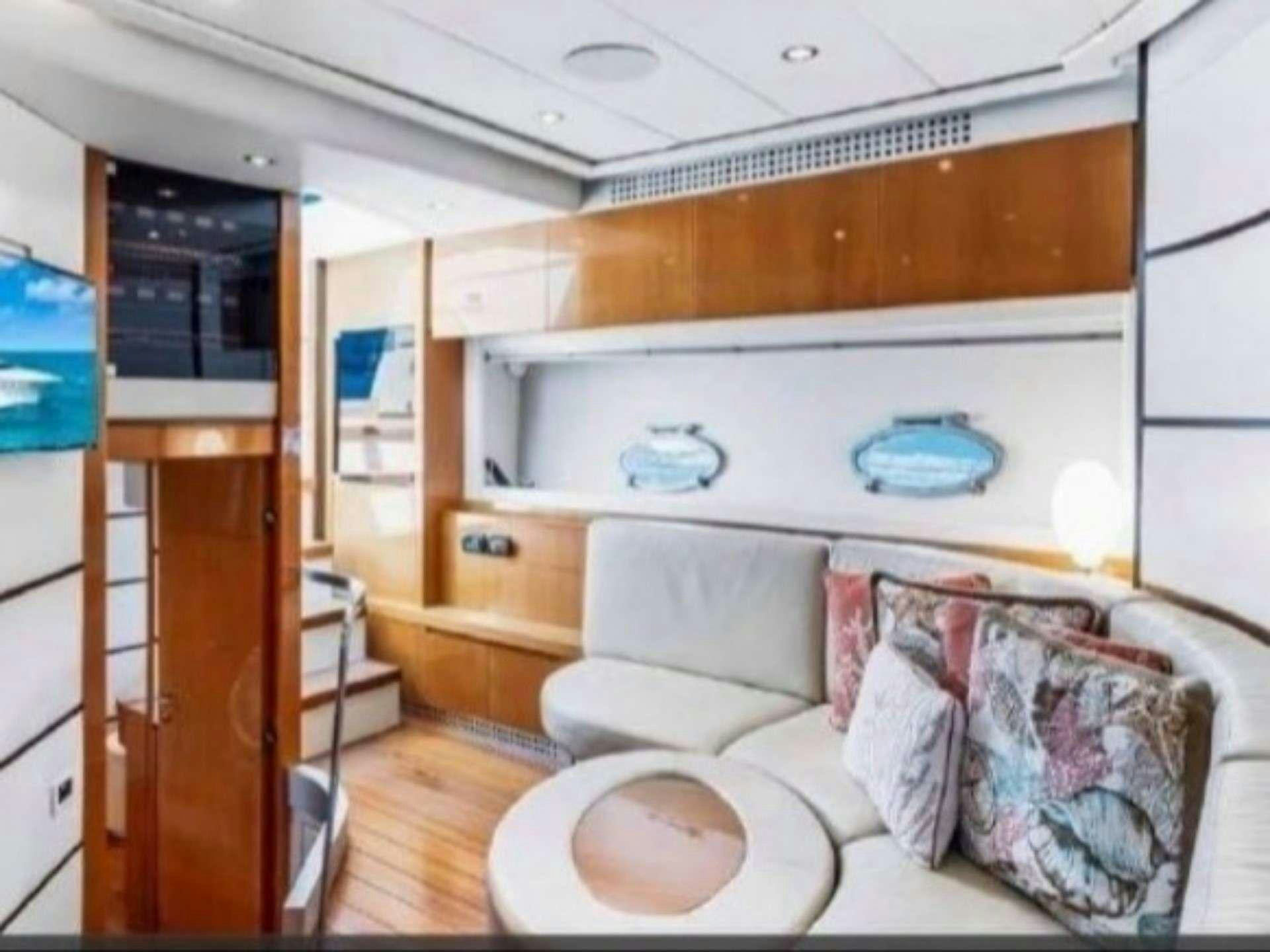 a room with a couch and a bed aboard SKY Yacht for Charter
