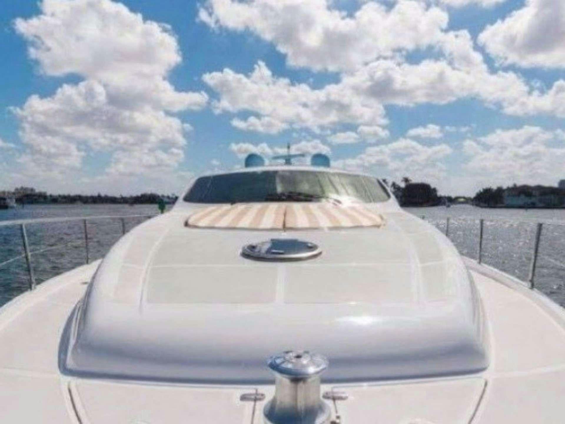 a white car on a road aboard SKY Yacht for Charter