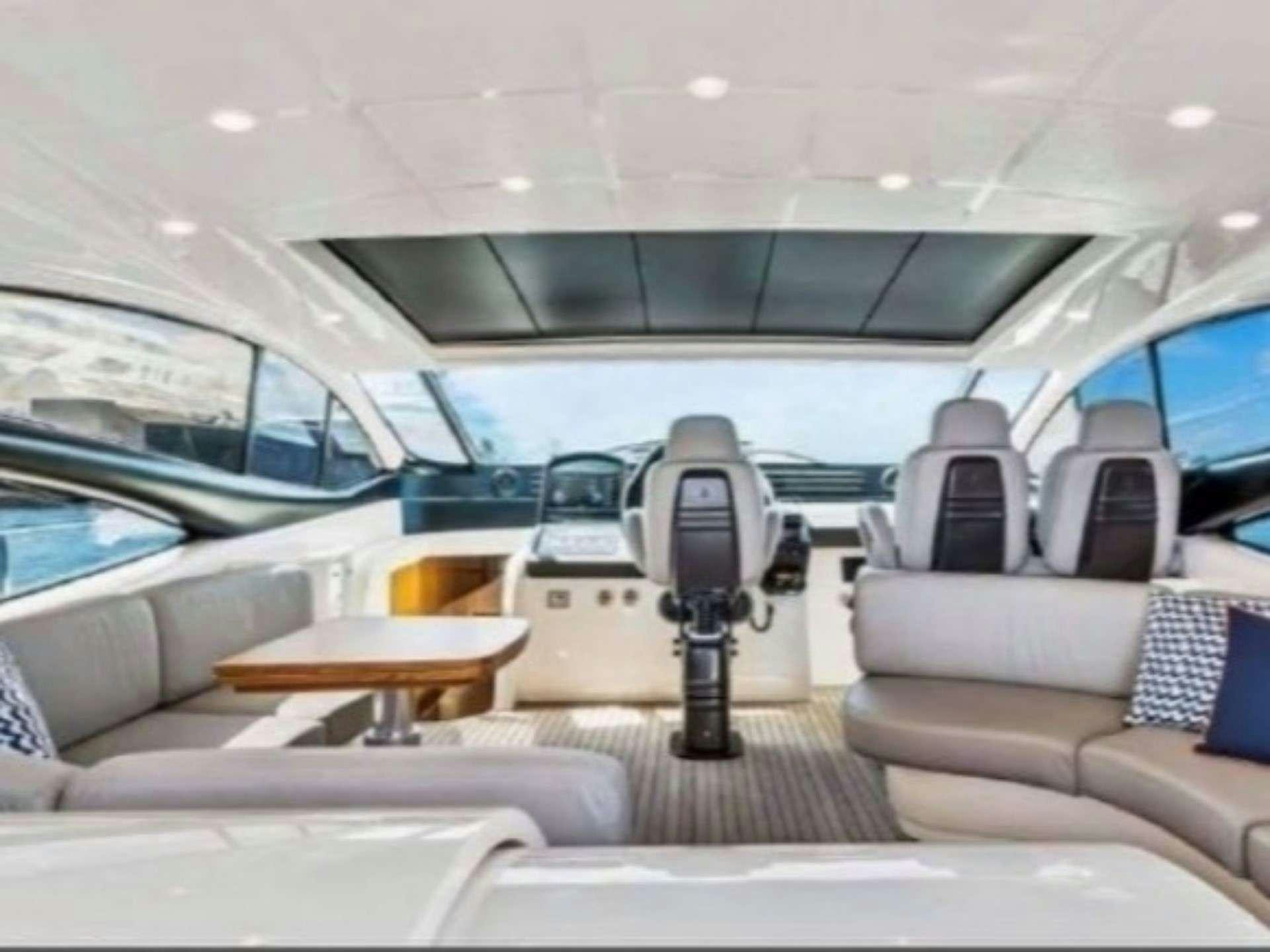 a car with a screen on the back aboard SKY Yacht for Charter