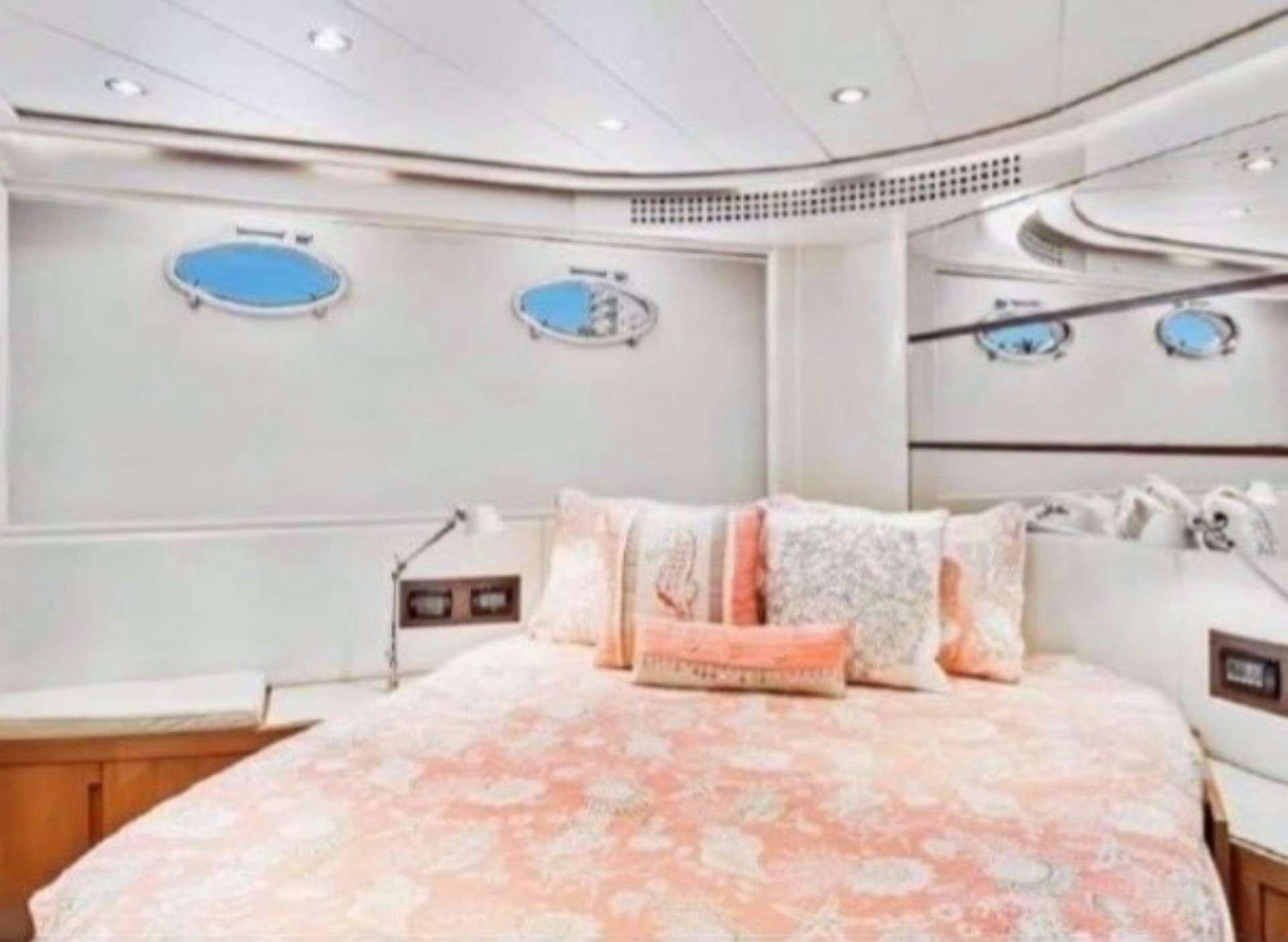 a bedroom with a bed aboard SKY Yacht for Charter