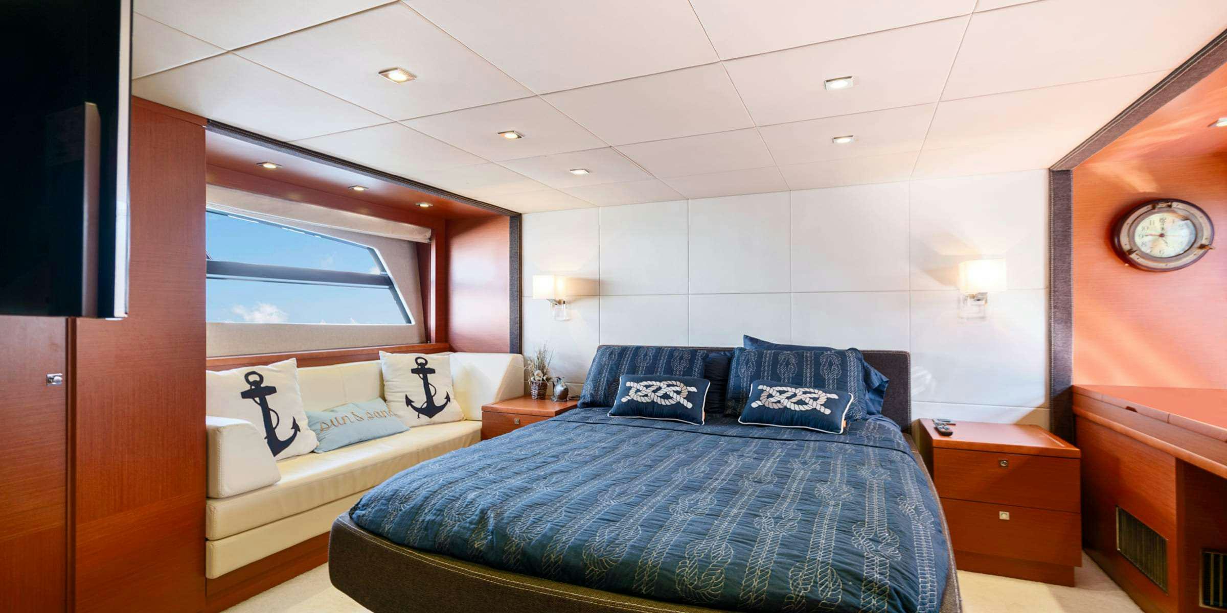 a room with two beds aboard Legacy Yacht for Charter