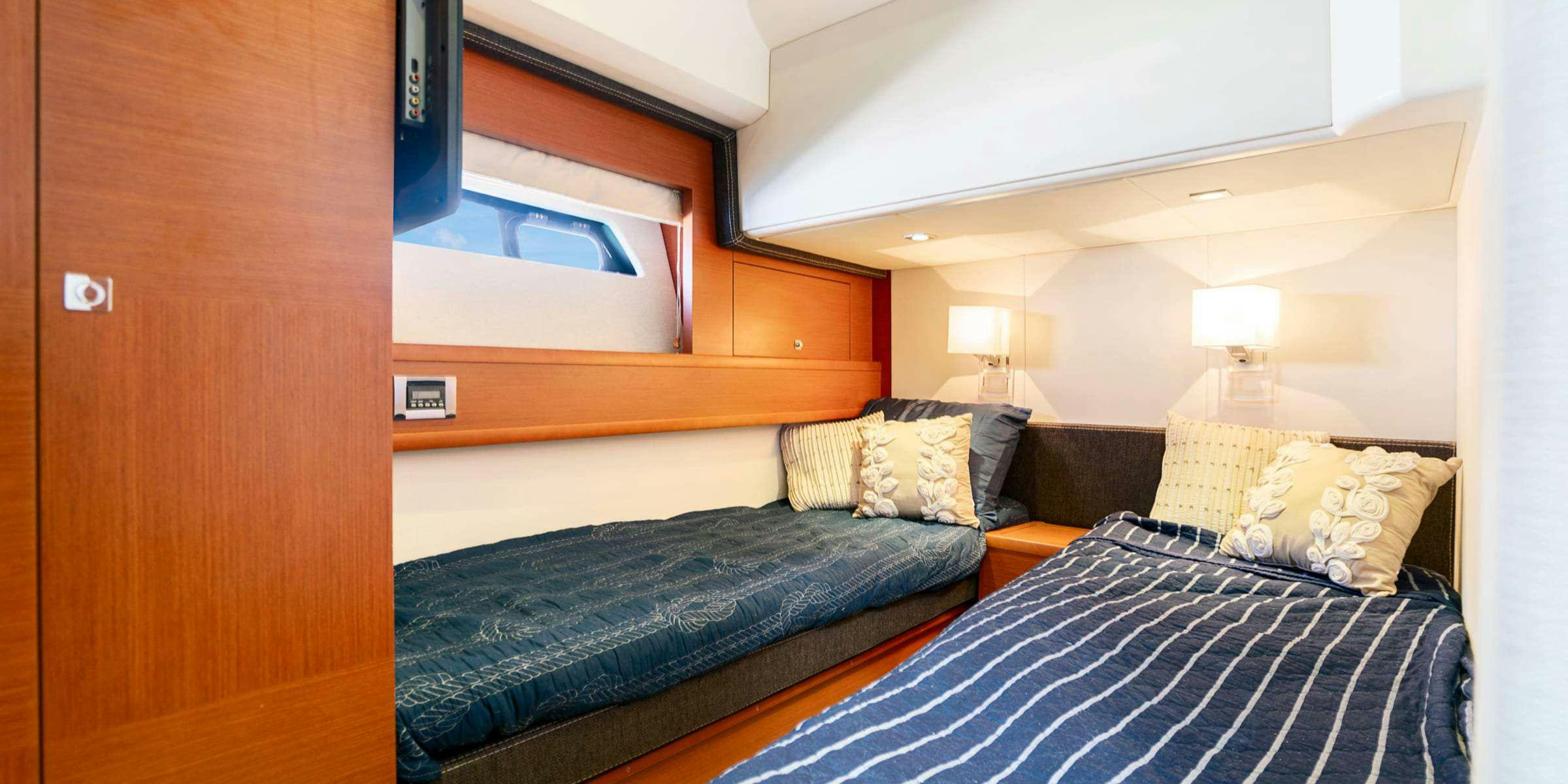a room with two beds aboard Legacy Yacht for Charter