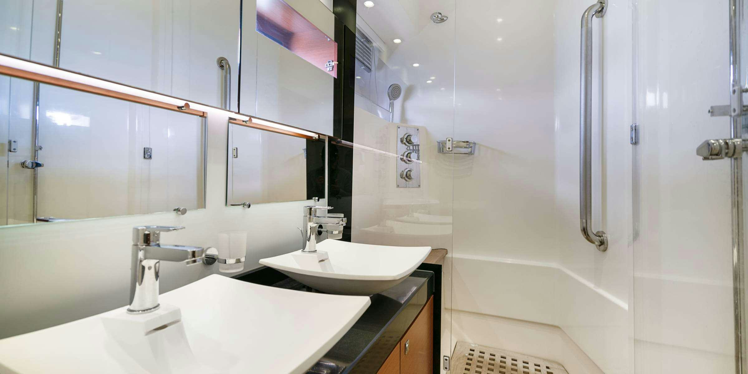 a bathroom with two sinks aboard Legacy Yacht for Charter