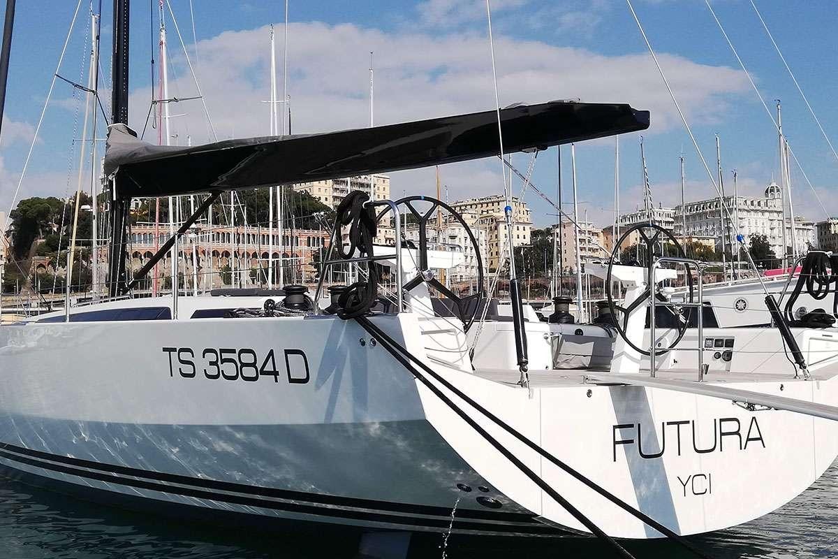 a couple of boats in a harbor aboard Futura Yacht for Charter
