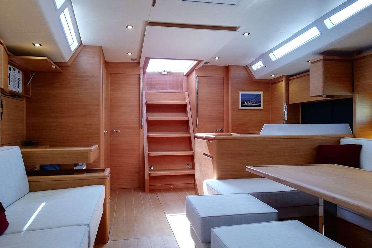 a room with wooden walls and a staircase aboard Futura Yacht for Charter