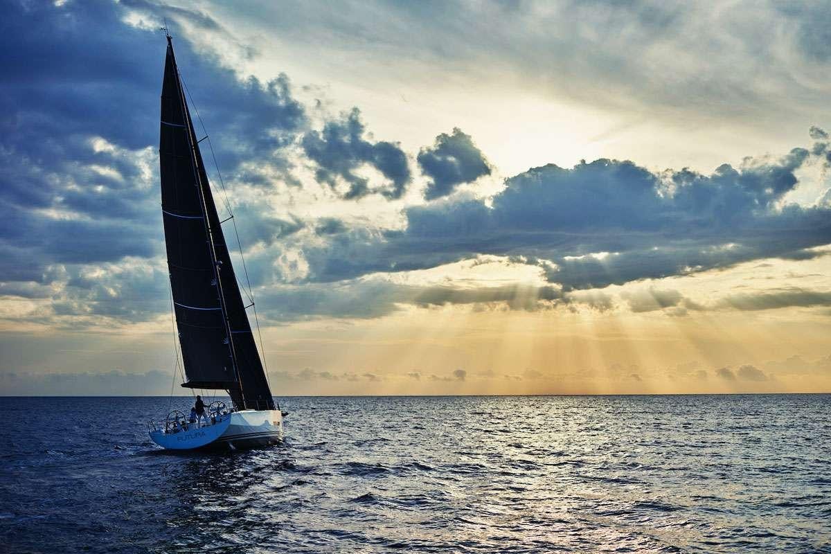 a sailboat in the water aboard Futura Yacht for Charter