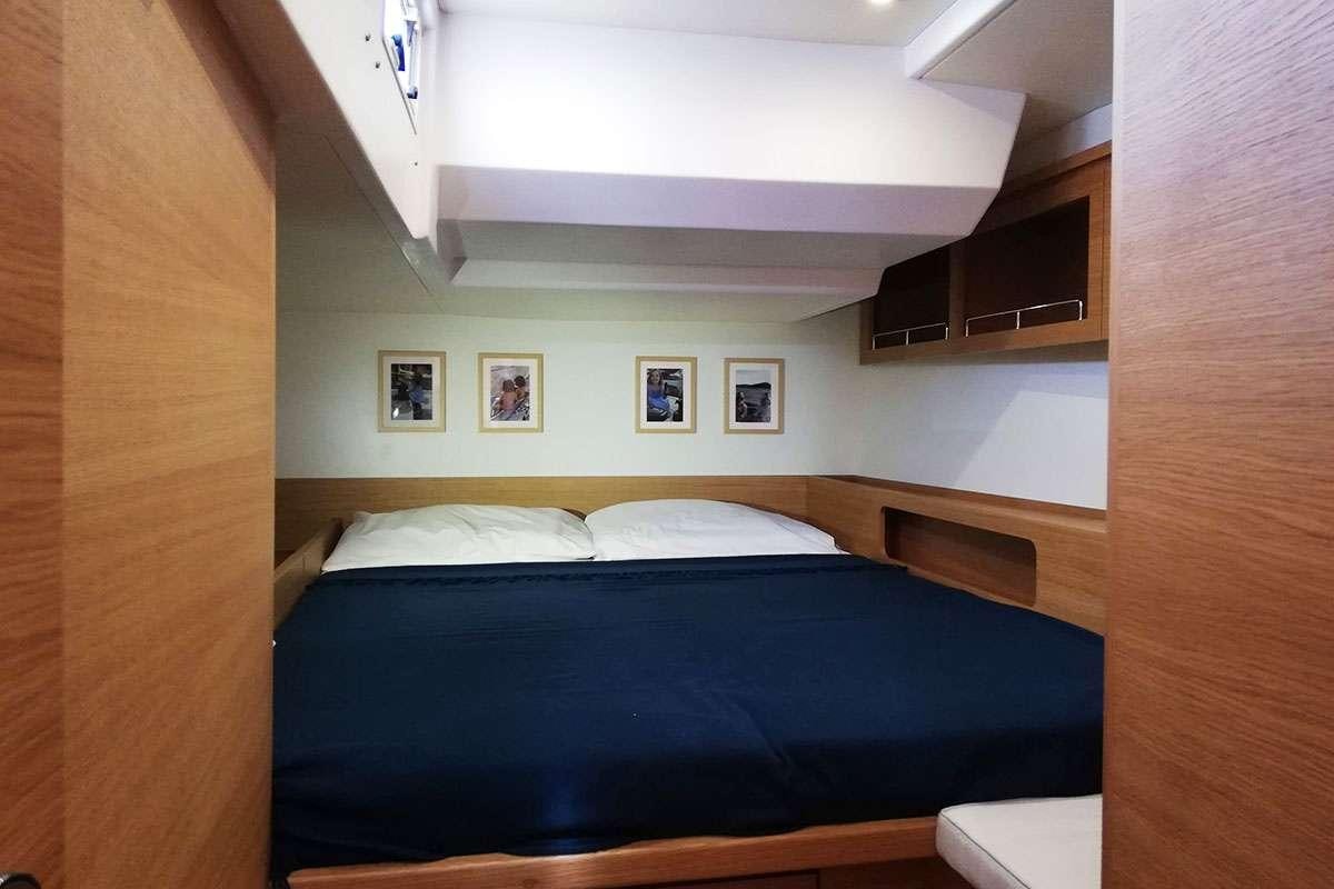 a bed in a room aboard Futura Yacht for Charter