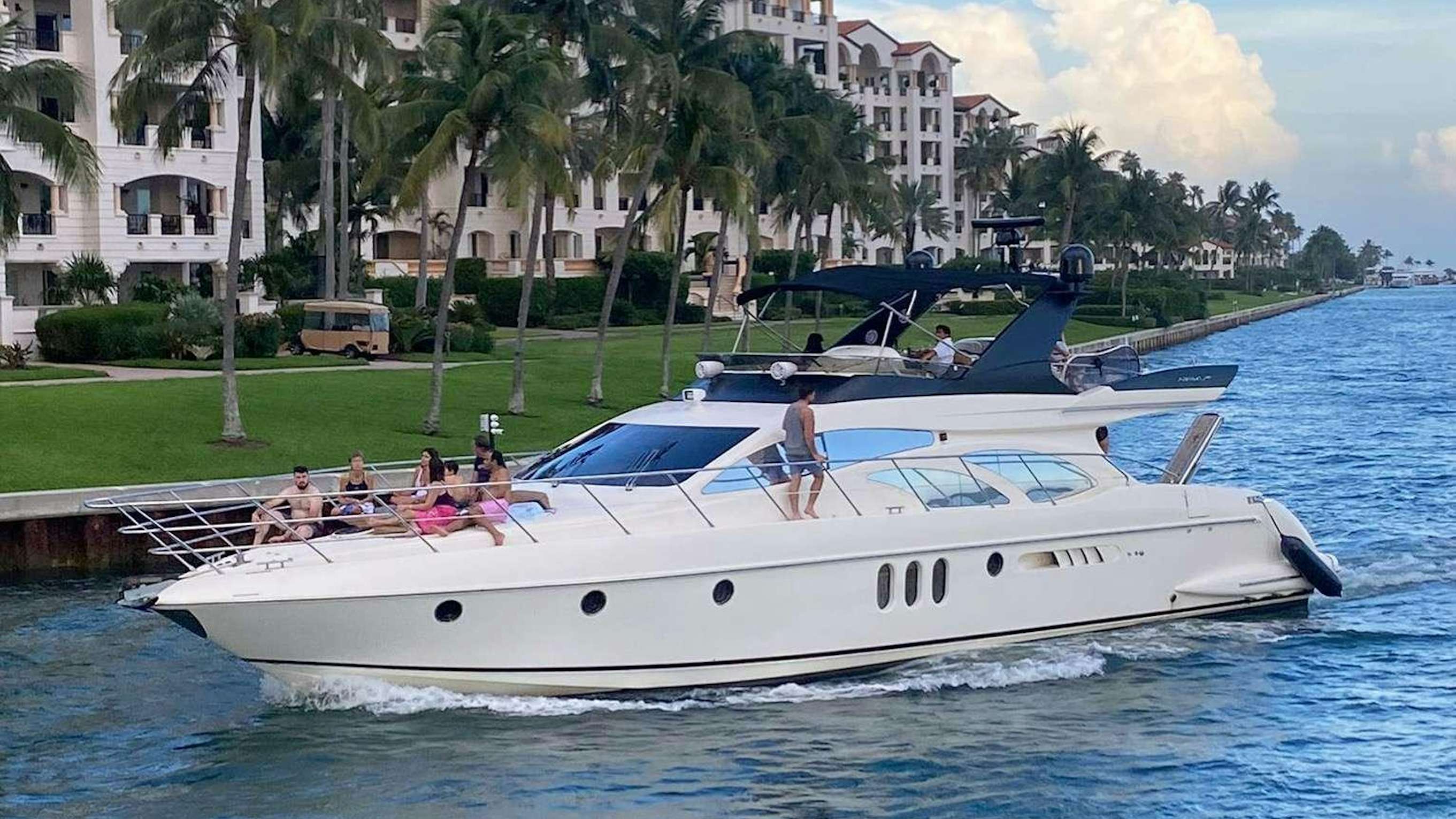 a white boat on the water aboard PRICELESS Yacht for Charter