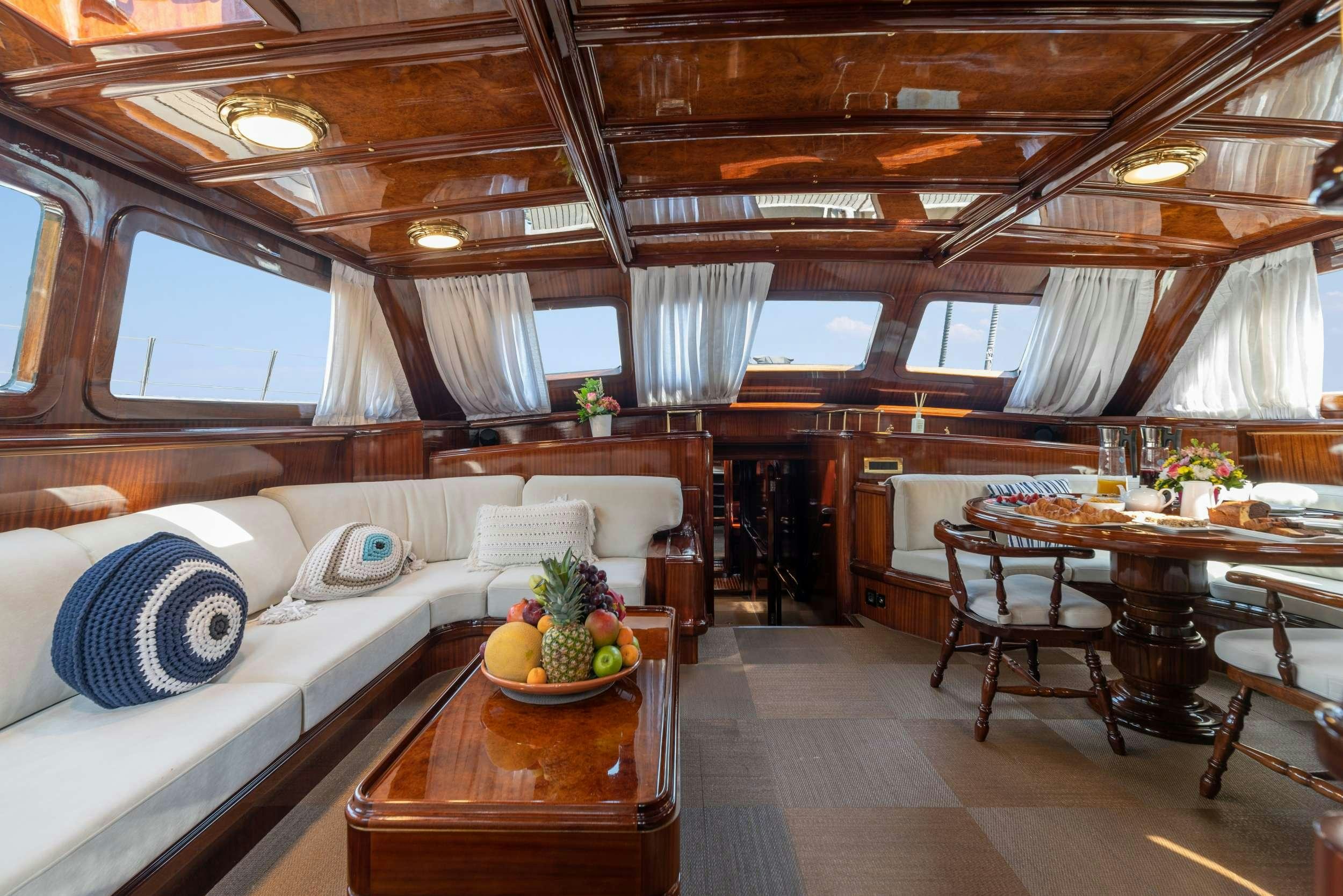 a room with a bed and a table aboard SPIRIT L Yacht for Charter