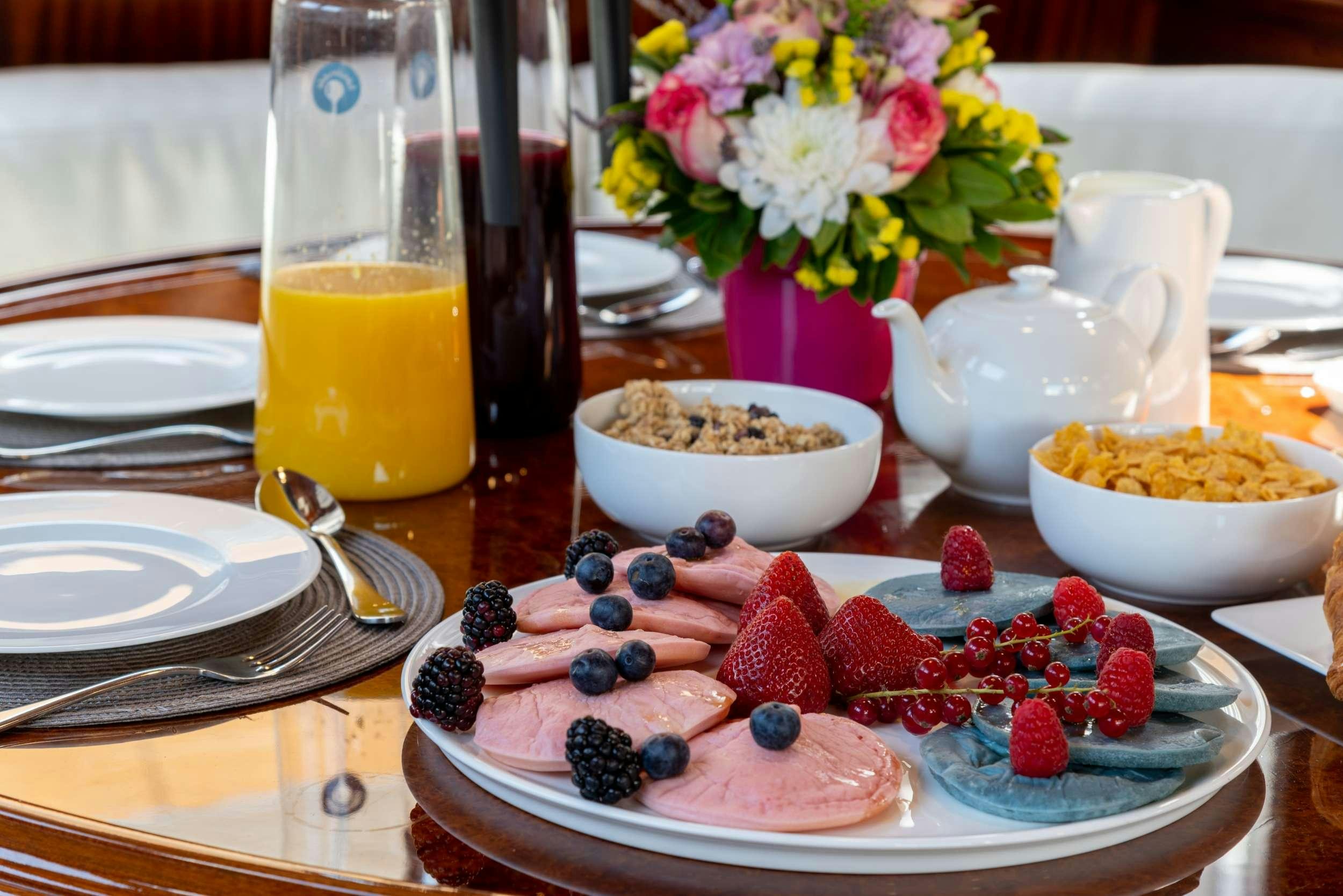 a table with food and drinks aboard SPIRIT L Yacht for Charter