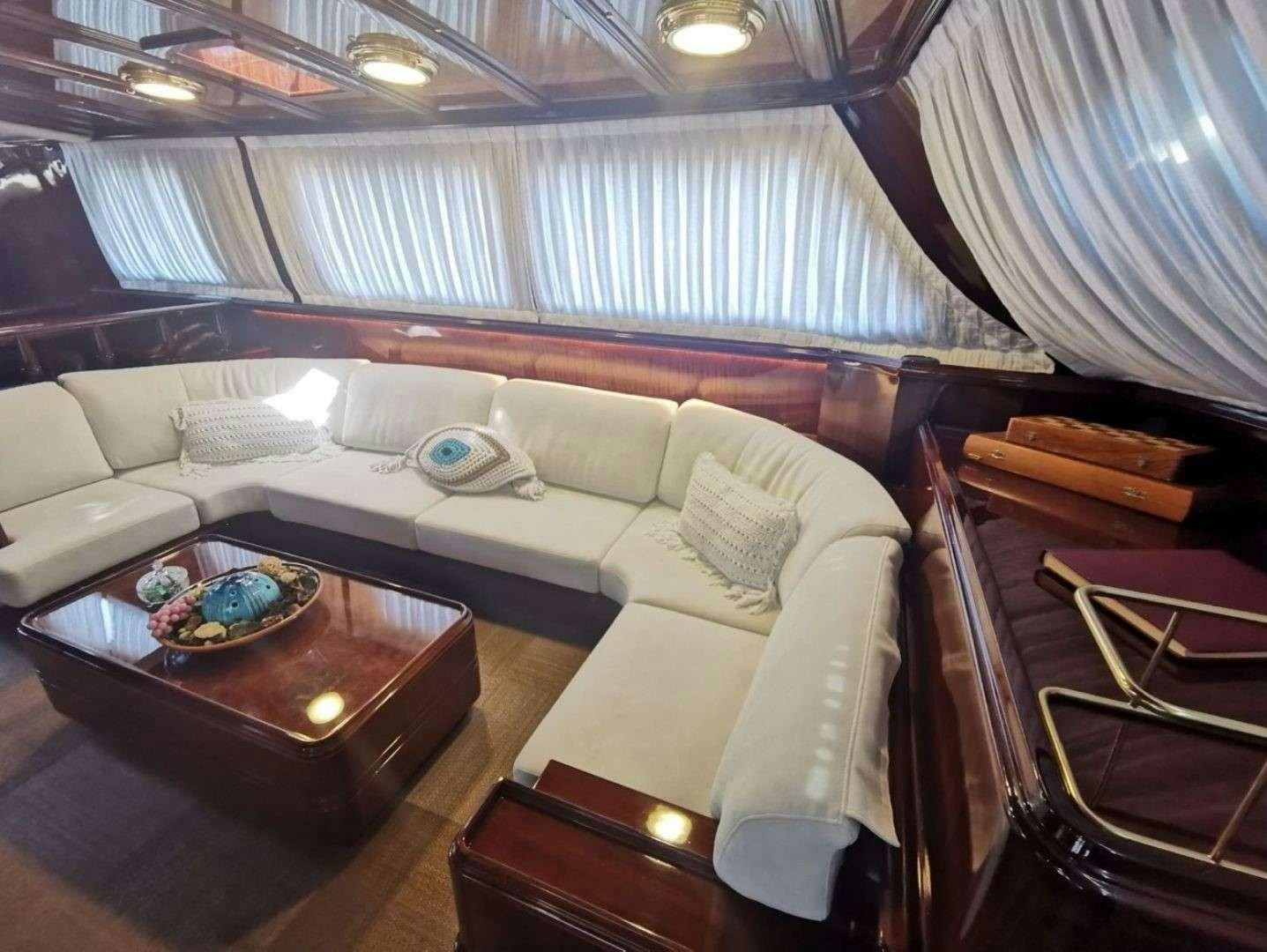 a room with a bed and a table aboard SPIRIT L Yacht for Charter