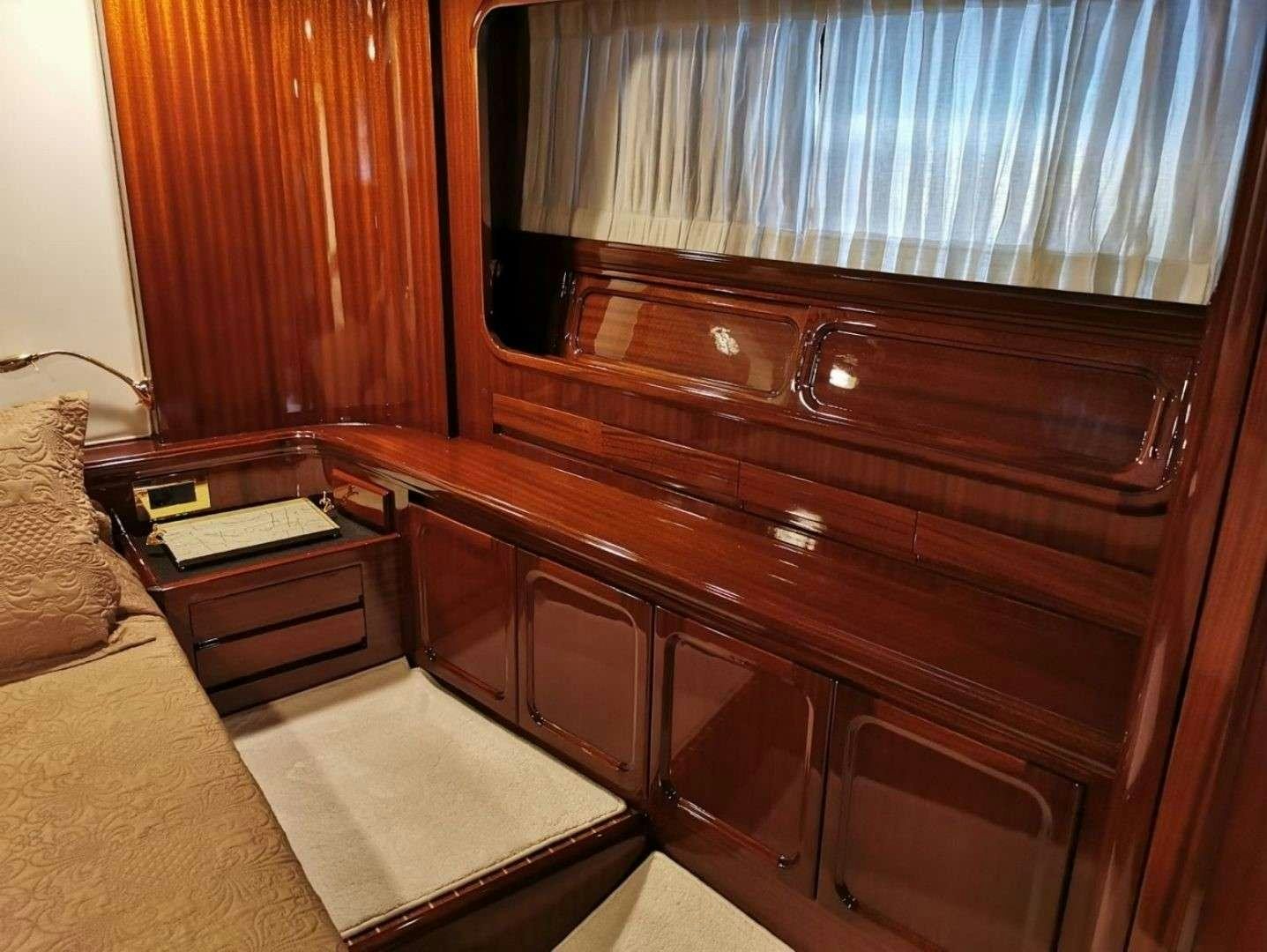 a wooden dresser with a book on it aboard SPIRIT L Yacht for Charter