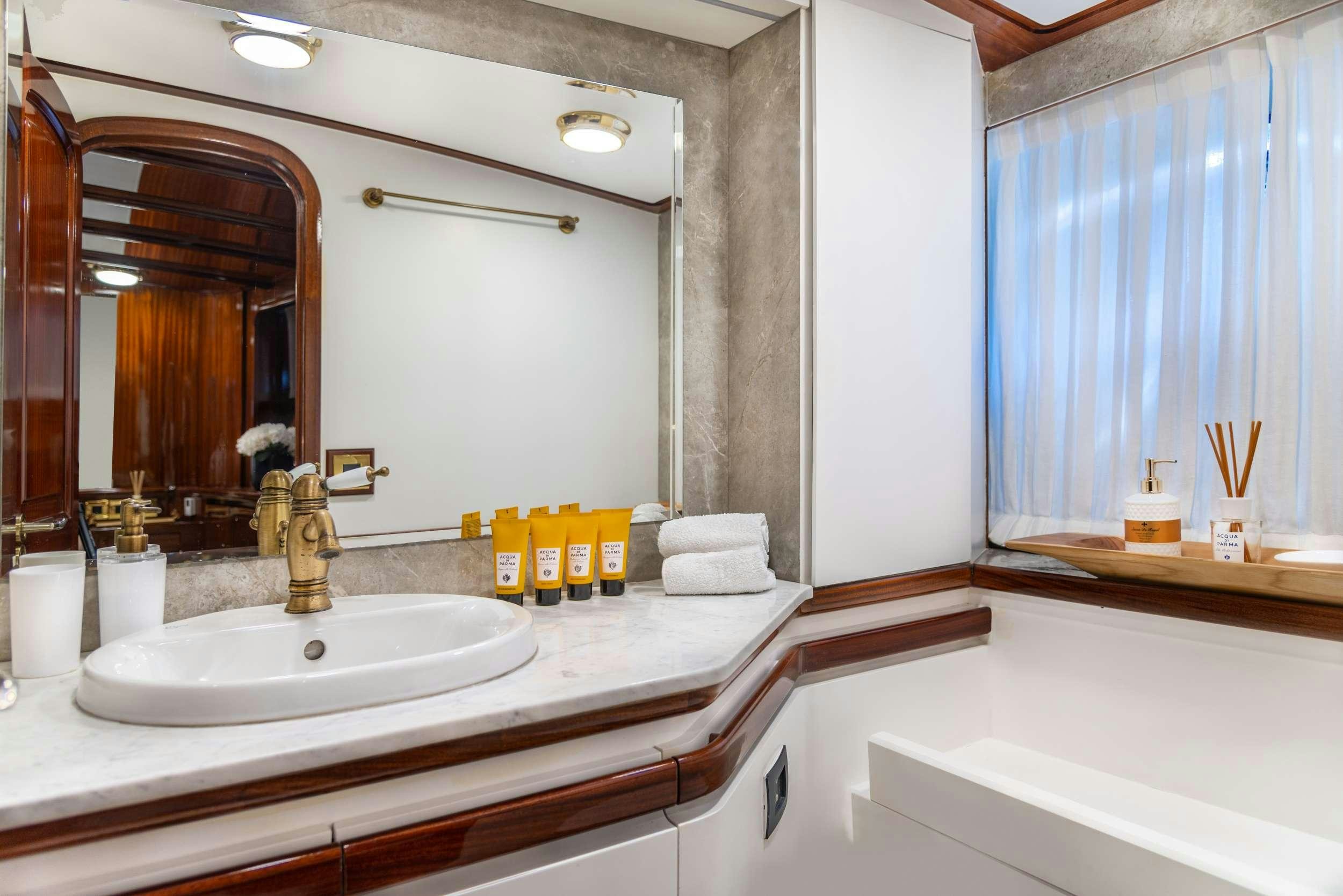 a bathroom with a large mirror aboard SPIRIT L Yacht for Charter