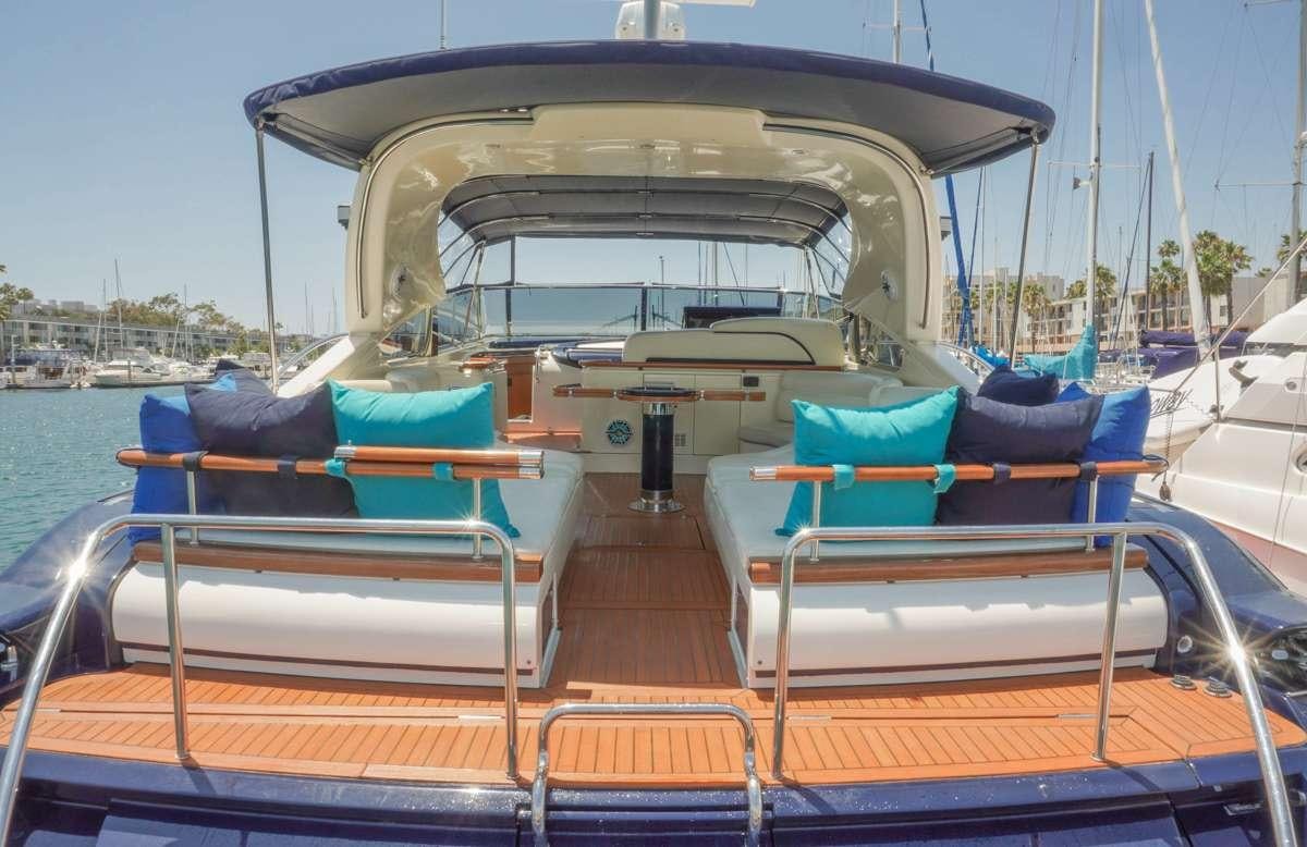 a boat with a canopy aboard EXPRESSO Yacht for Charter