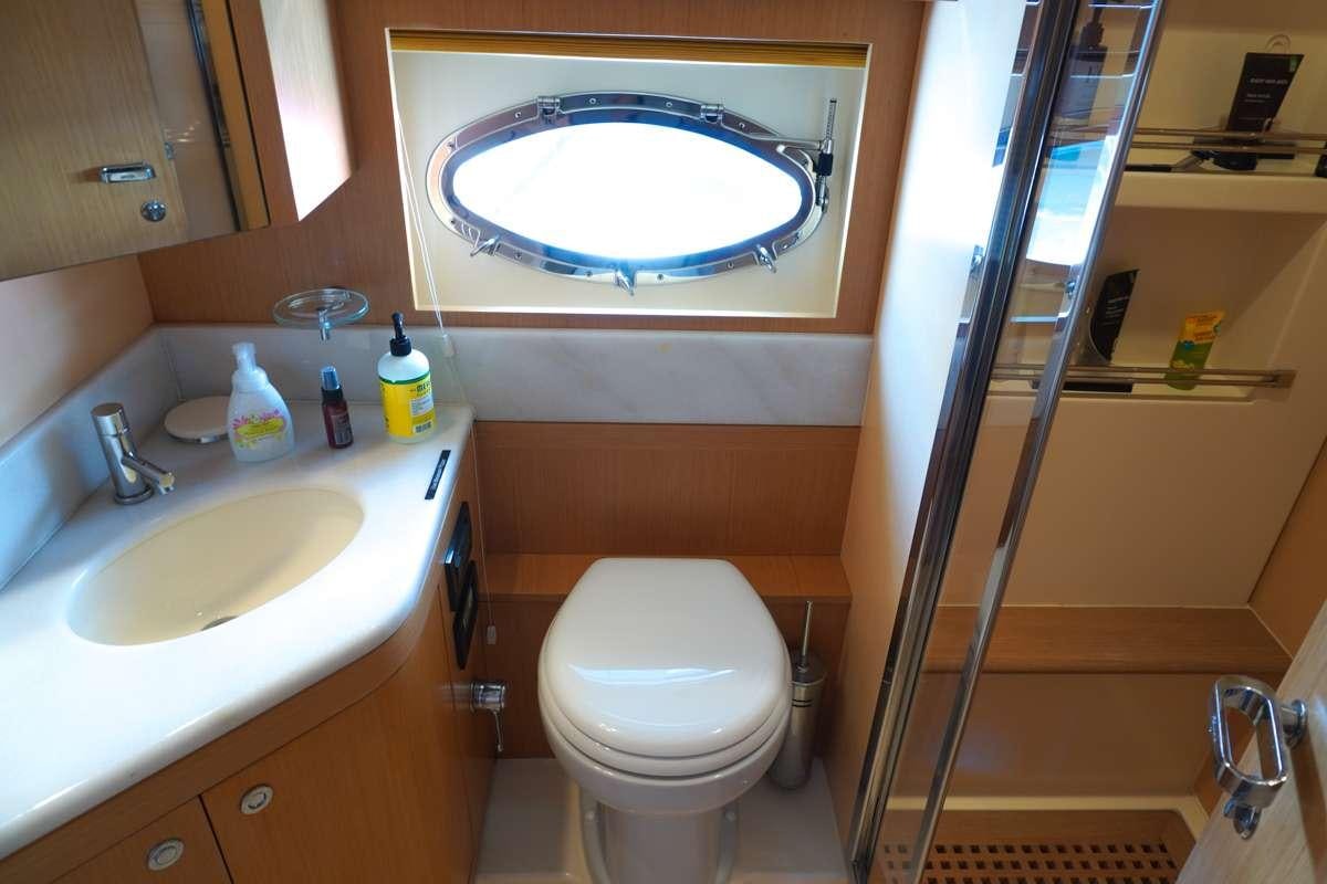 a bathroom with a large mirror aboard EXPRESSO Yacht for Charter