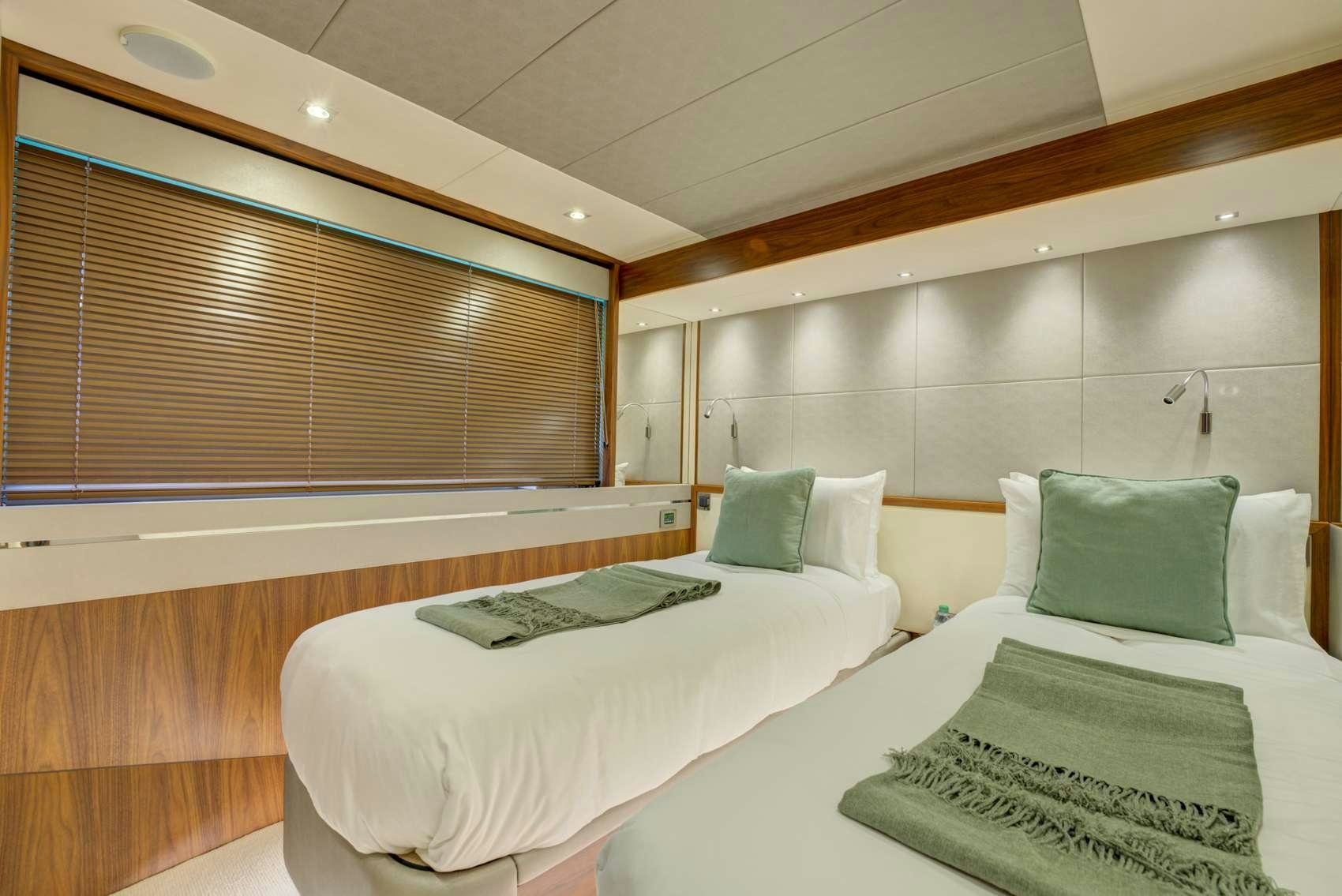 a room with two beds aboard MIKEL ANGELO Yacht for Charter