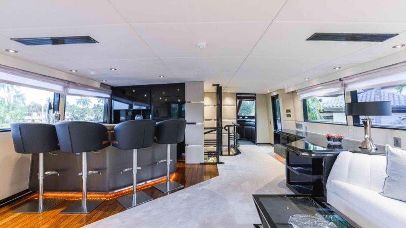a living room with a large open floor plan aboard QUANTUM Yacht for Charter