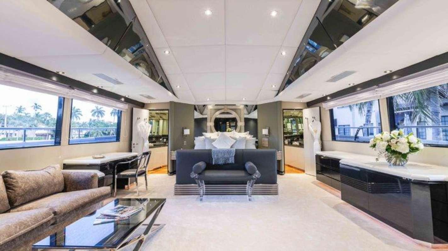 a living room with a couch and a table aboard QUANTUM Yacht for Charter