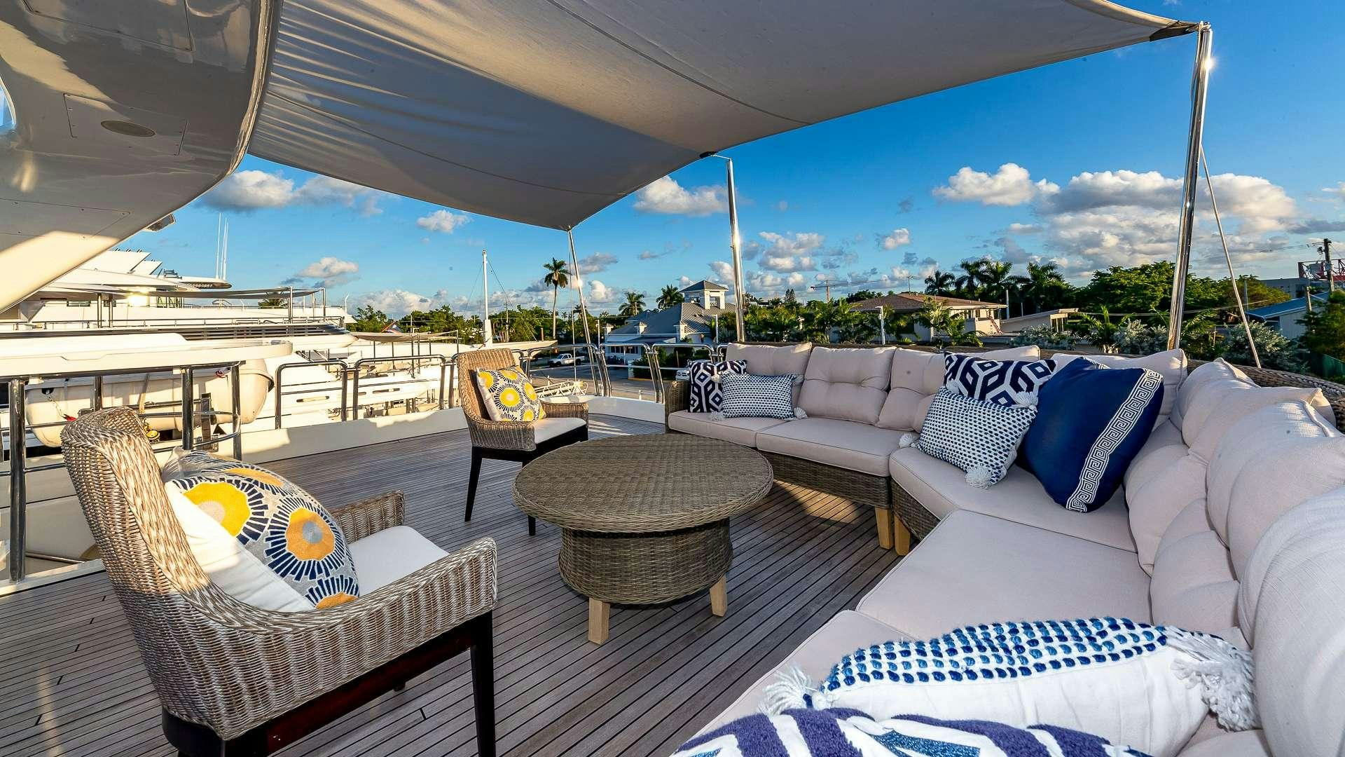 a patio with a table and chairs aboard POUR ANOTHER Yacht for Charter