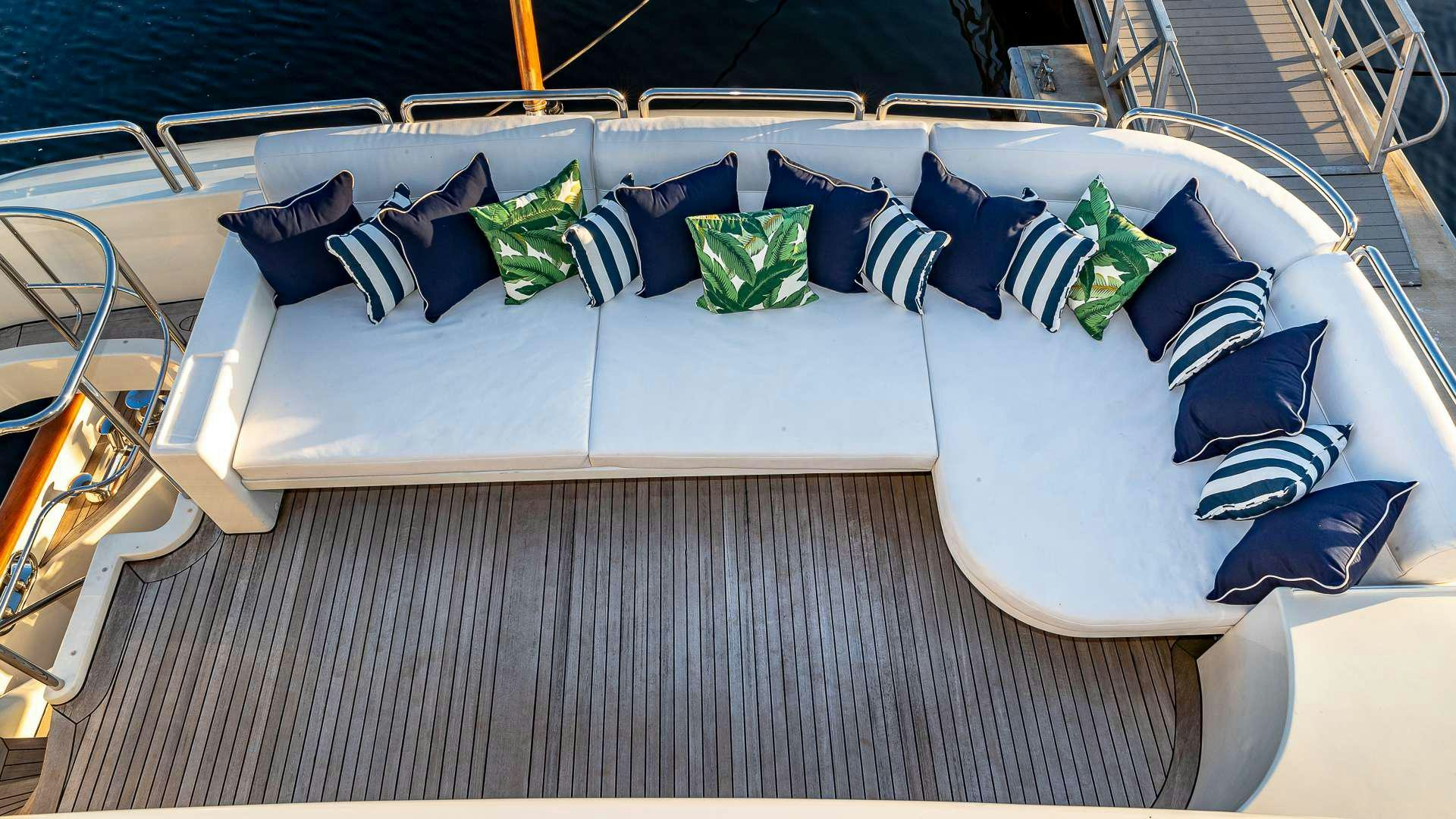 a bed with pillows on it aboard POUR ANOTHER Yacht for Charter