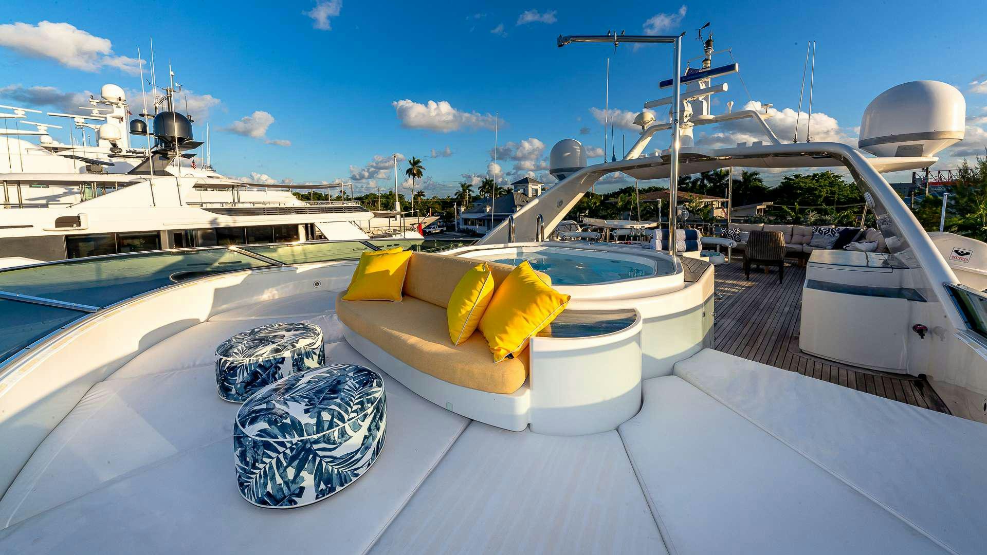 a boat with yellow cushions on a deck aboard POUR ANOTHER Yacht for Charter