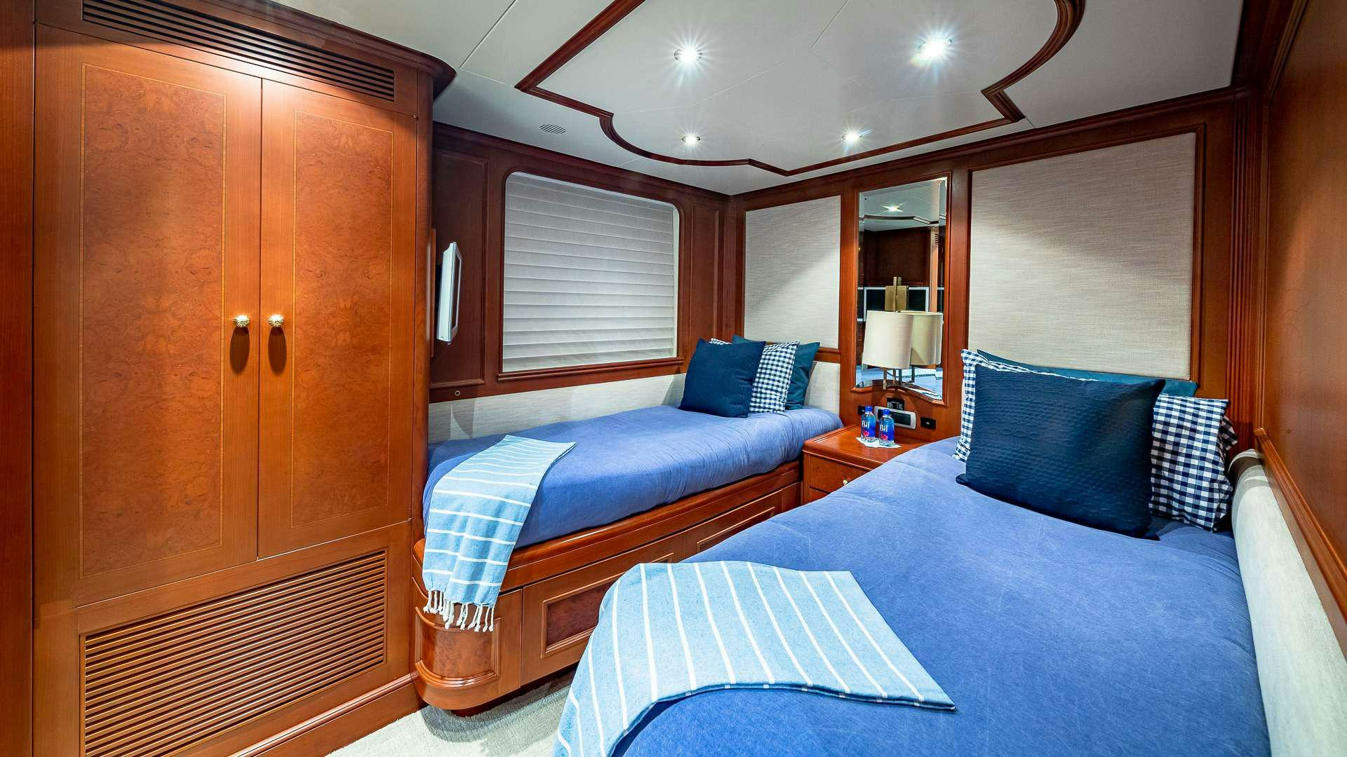 a couple of beds in a hotel room aboard POUR ANOTHER Yacht for Charter