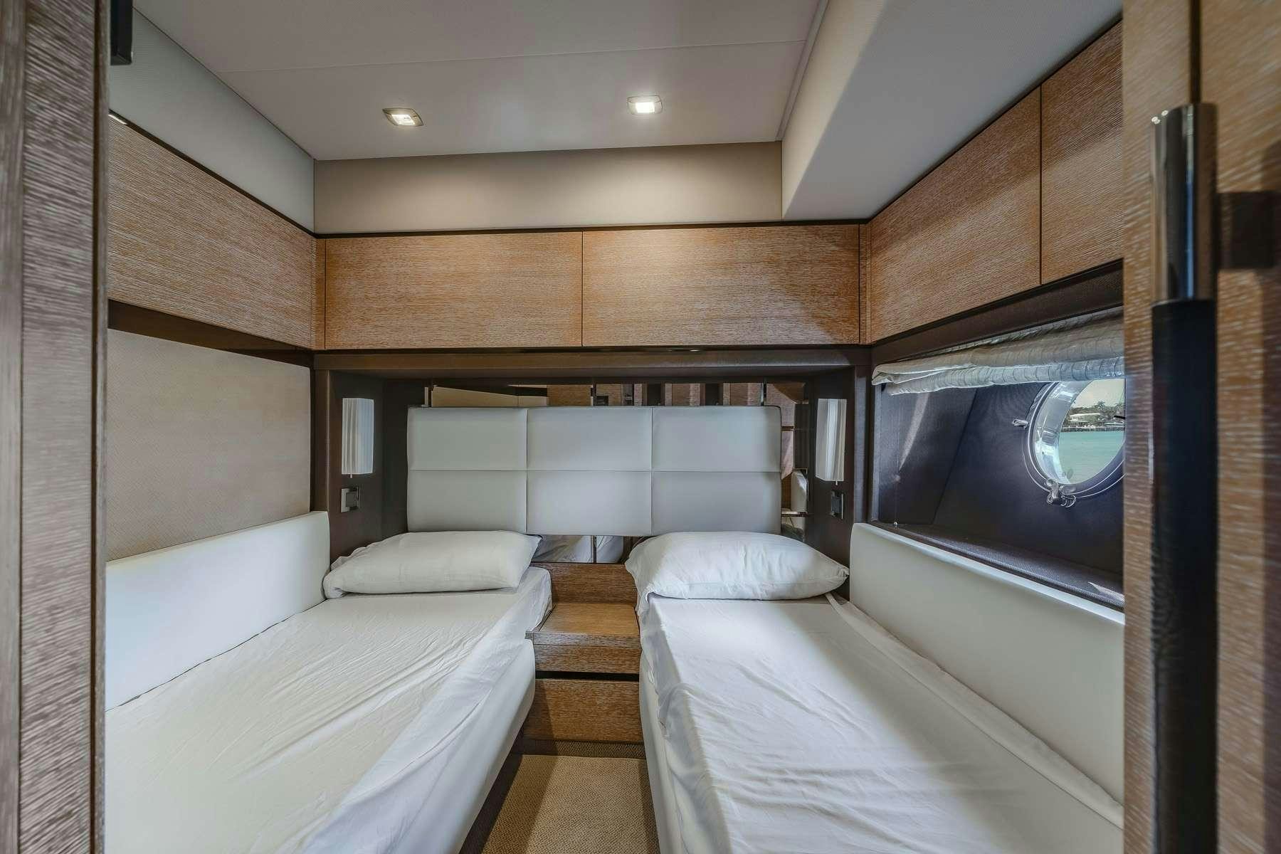 a room with a bed and a mirror aboard DAYS LIKE THIS Yacht for Charter
