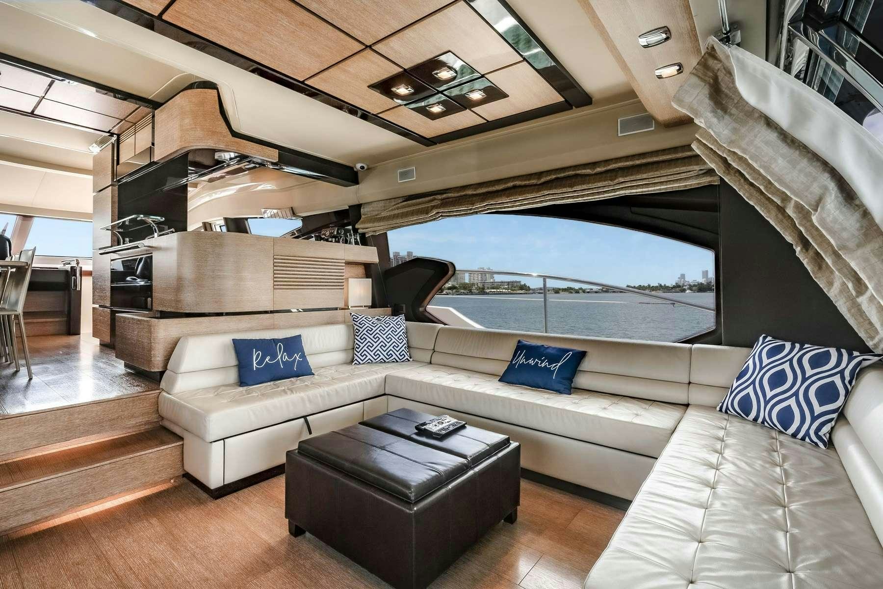 a living room with a large window aboard DAYS LIKE THIS Yacht for Charter